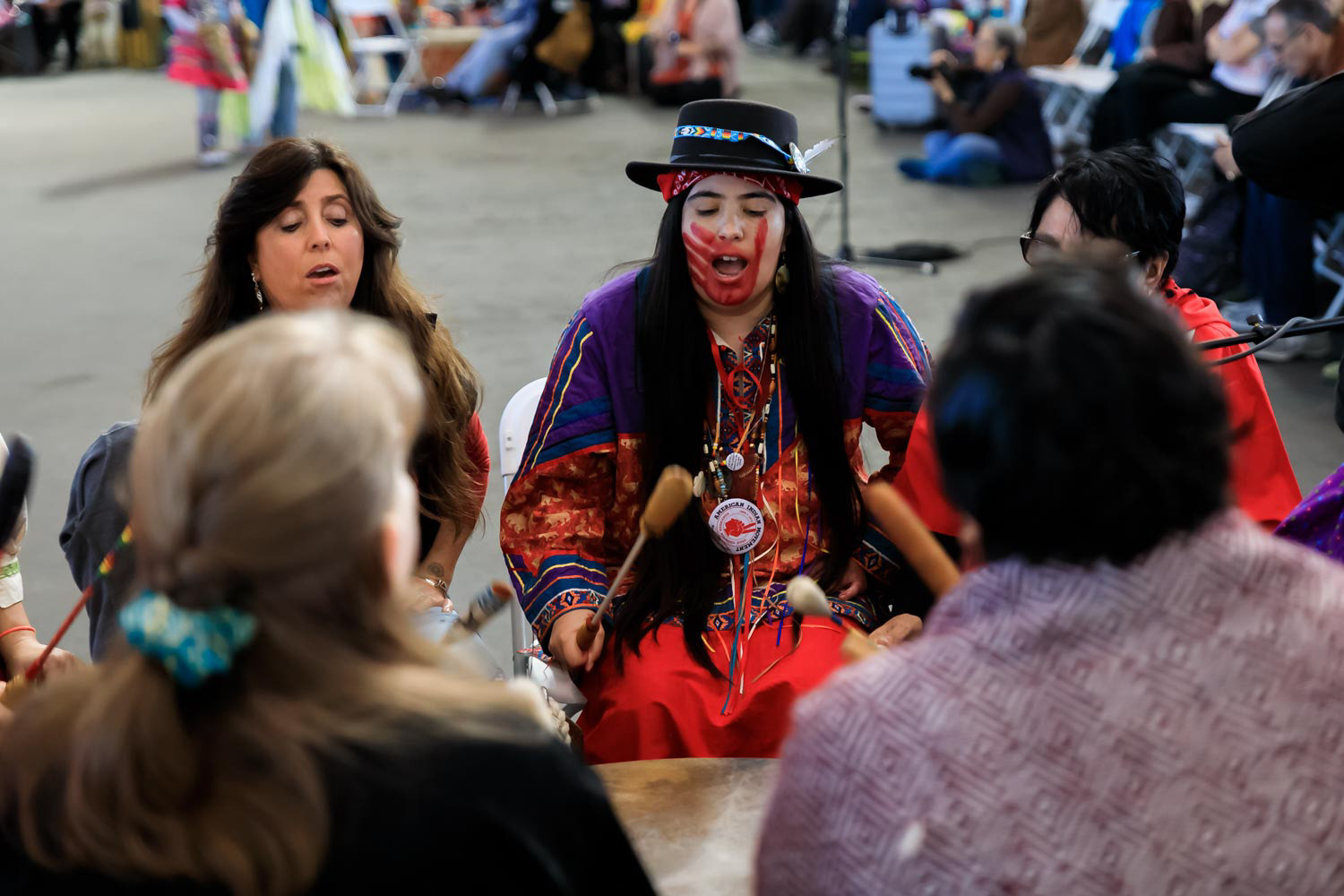 Native American women sing a tribal song at Two Sprit Pow Wow in San Francisco