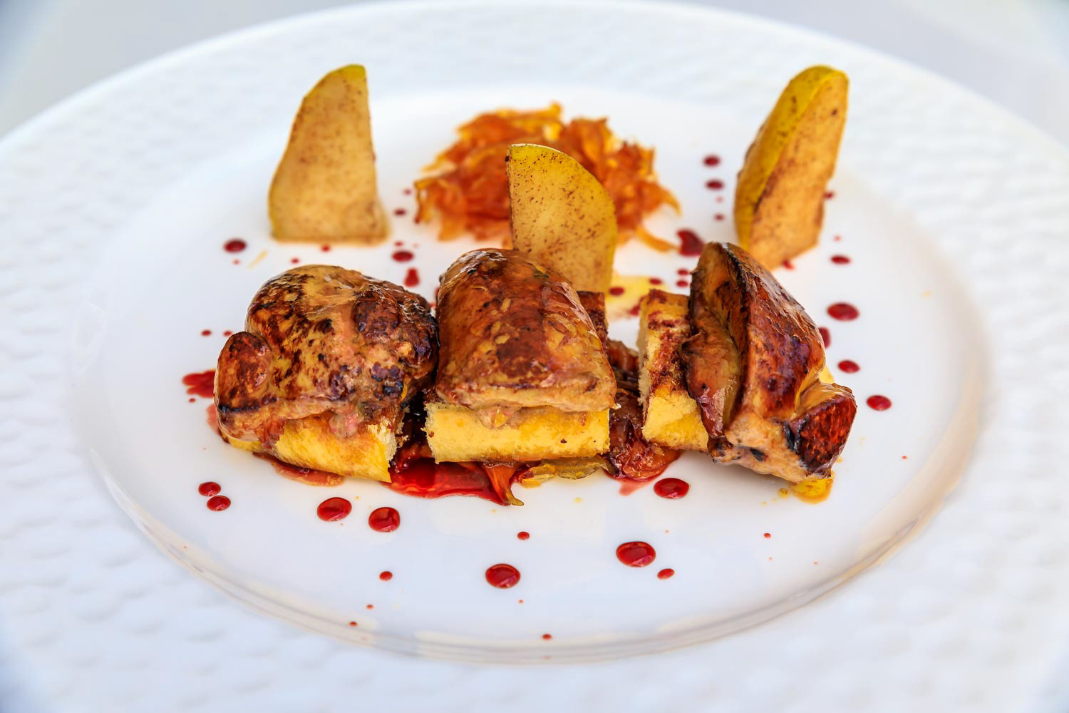 Pan seared foie gras appetizer on brioche, with pear, caramelized onions and fruit jam at a restaurant in Montenegro