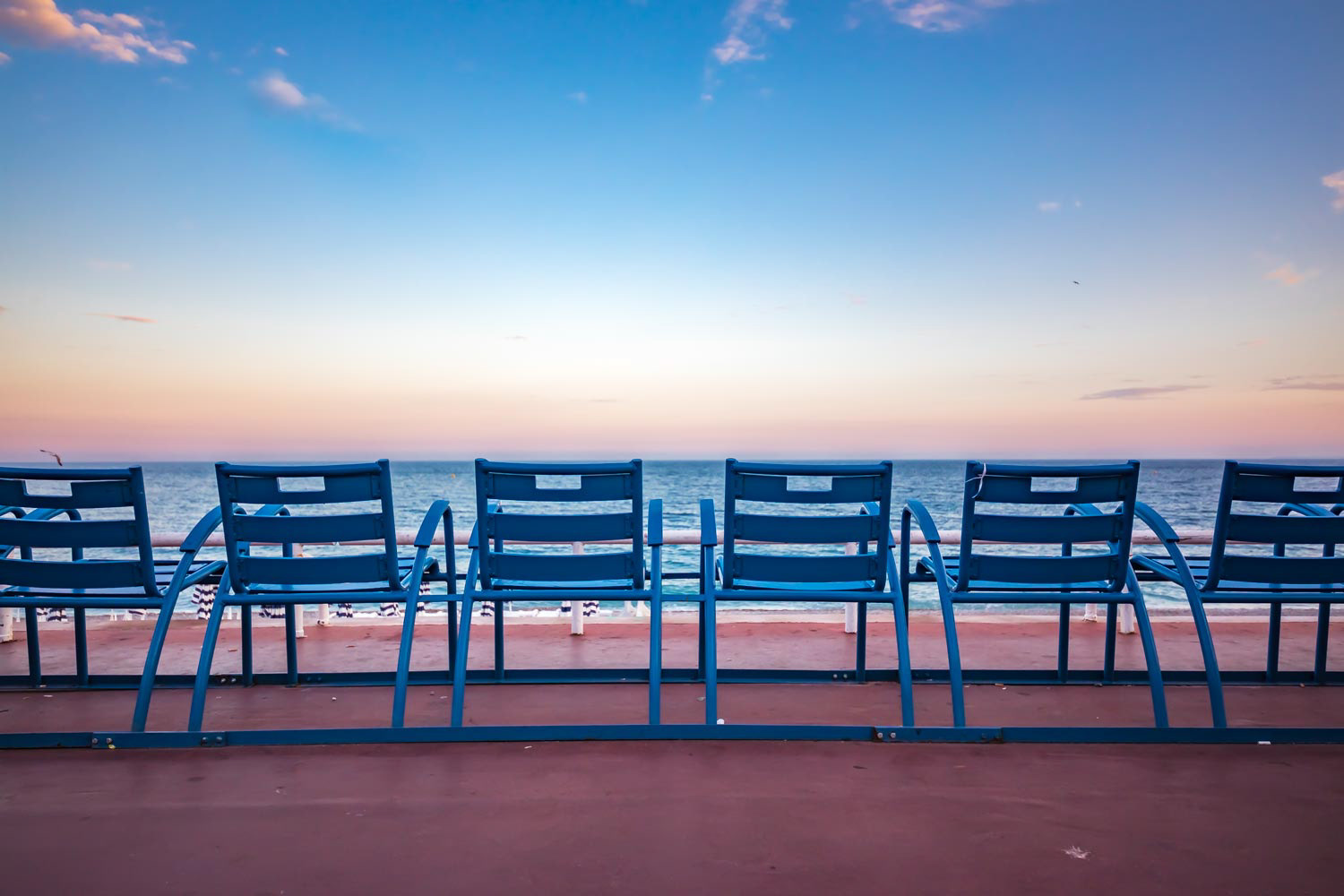 Blue chairs on the Promenade des Anglais in Nice France