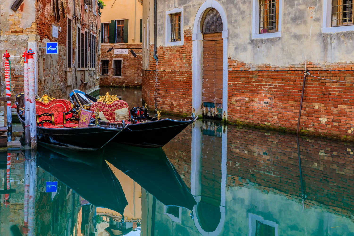 Gondola in picturesque canal in Venice Italy