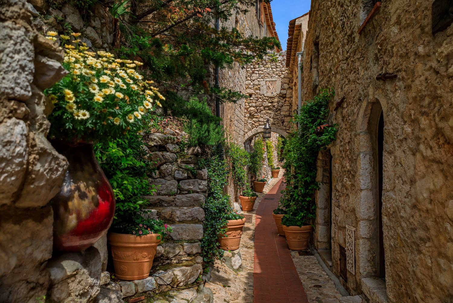 Old buildings on narrow streets in the medieval city of Eze Village in the South of France along the Mediterranean Sea