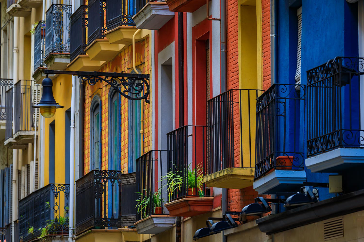 Colorful house facades in Pamplona Spain, town famous for bull running