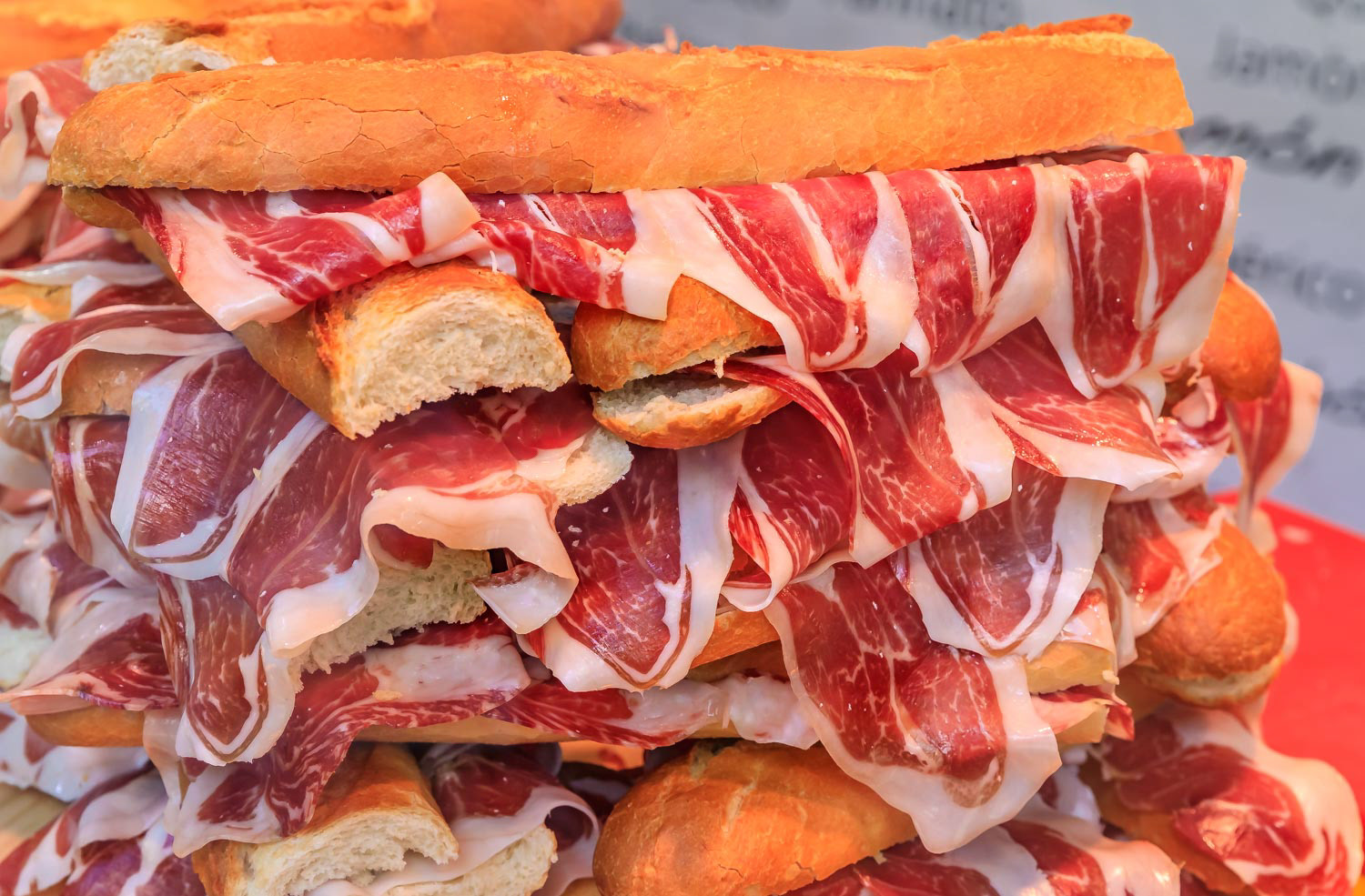 Serrano iberico ham sandwiches on display at a local sandwich shop in Madrid, Spain
