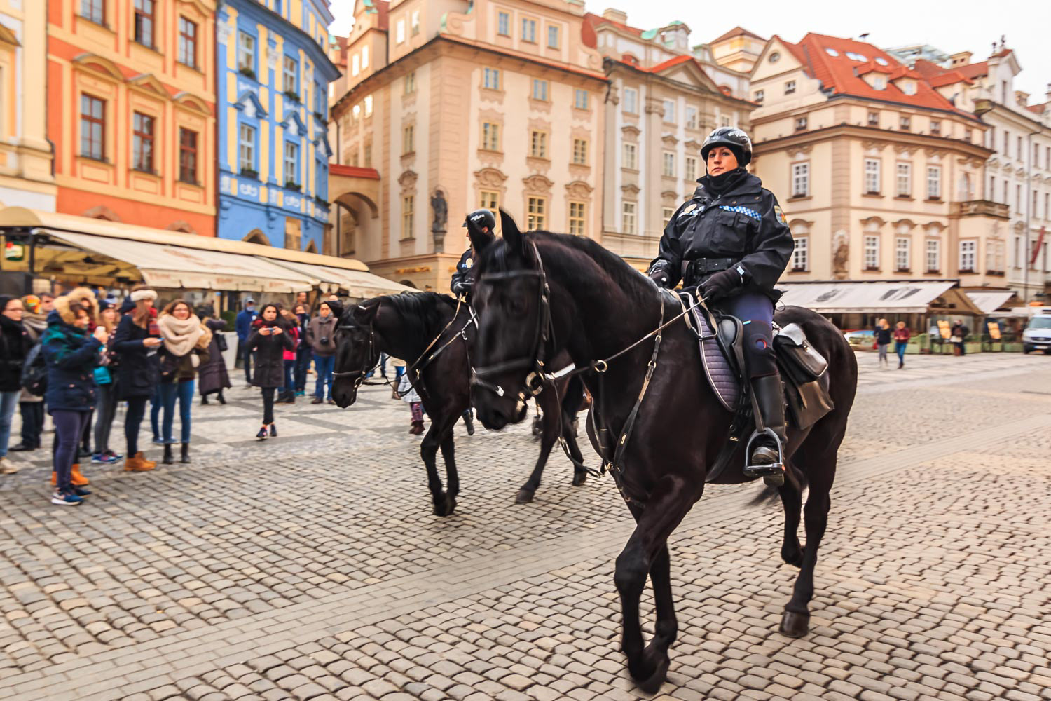 Czech mounted police officers on horses in Old Town Square Prague, Czech Republic