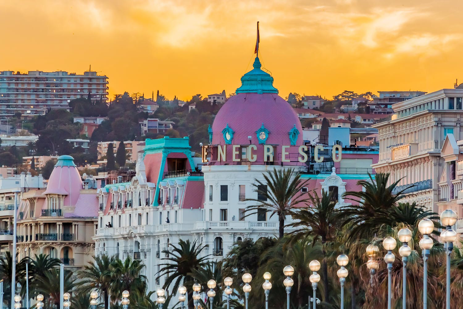 Famous luxury hotel Hotel Negresco on Promenade des Anglais in Nice France at sunset