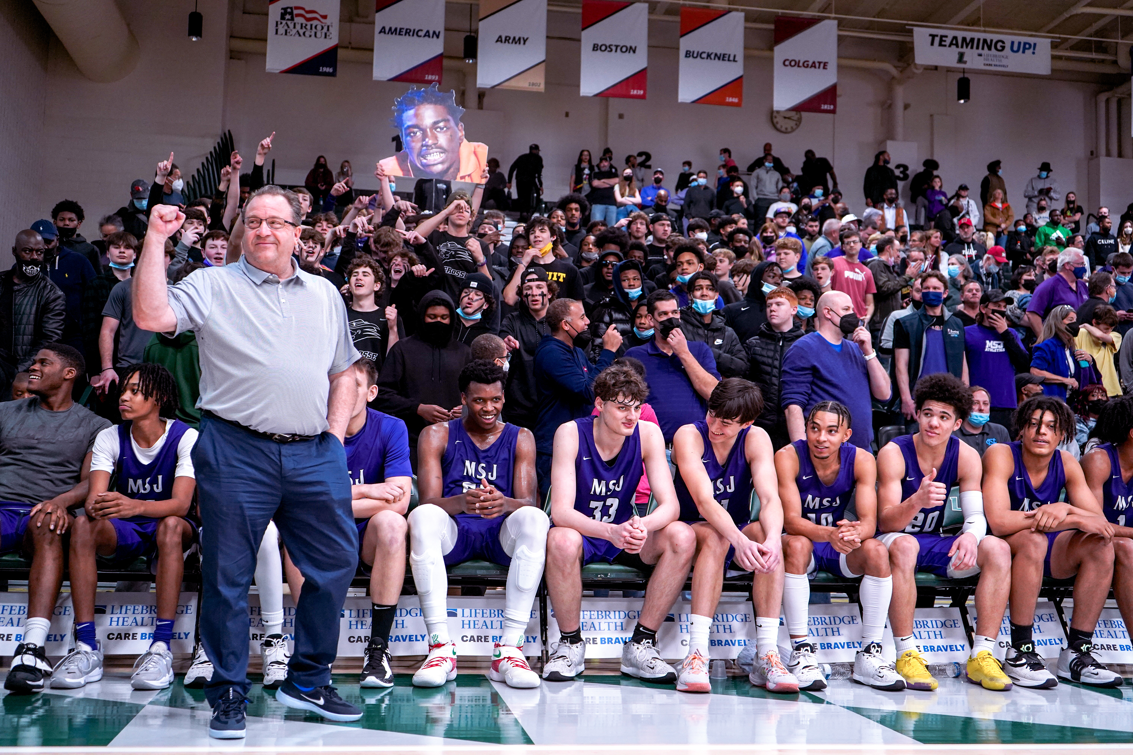 Coach Pat Clatchey begins to celebrate as Mount St Joseph secures the BCL Championship