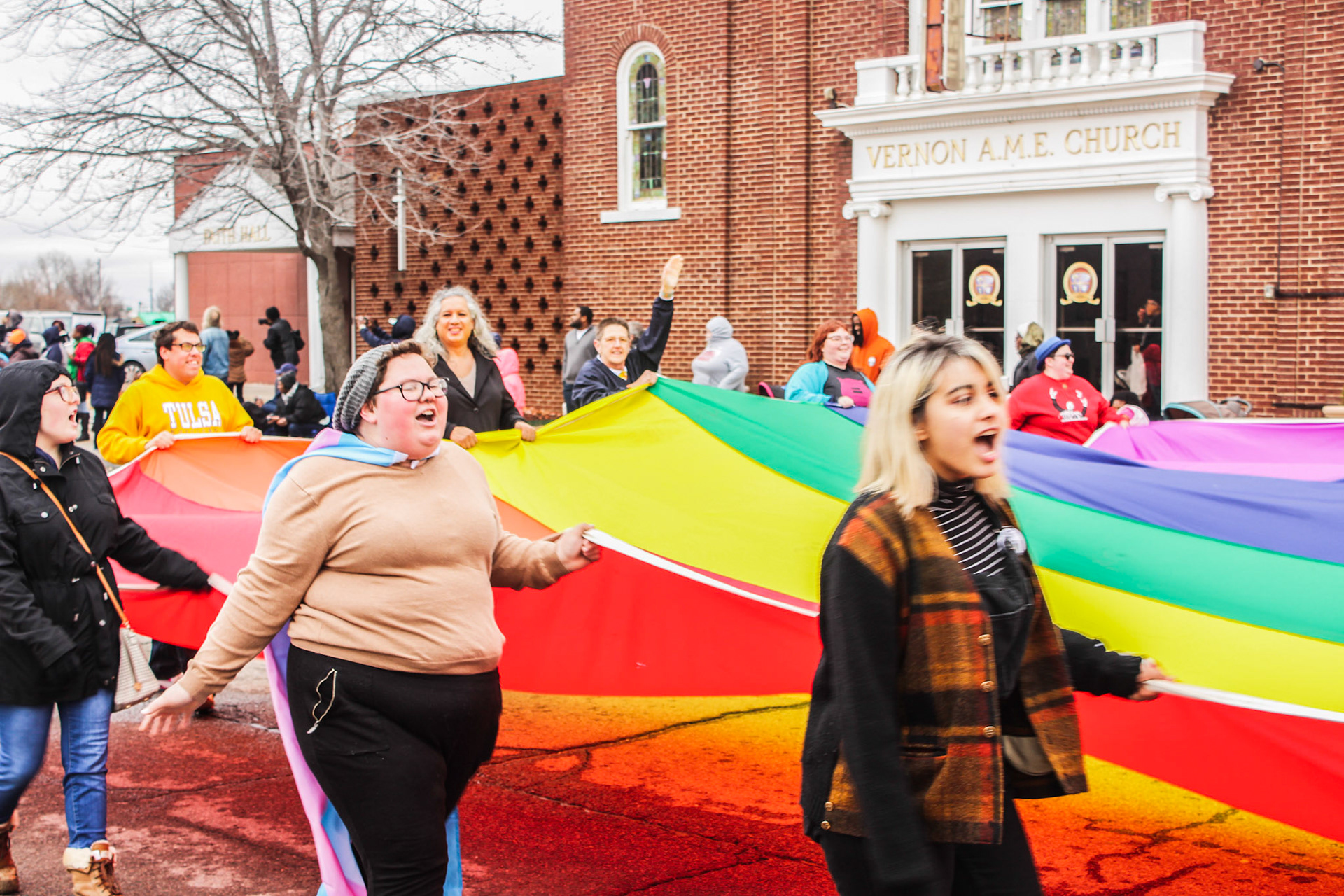 An LGBTQ+ rights group walks in Tulsa's Martin Luther King Jr. parade in the historic Greenwood neighborhood.