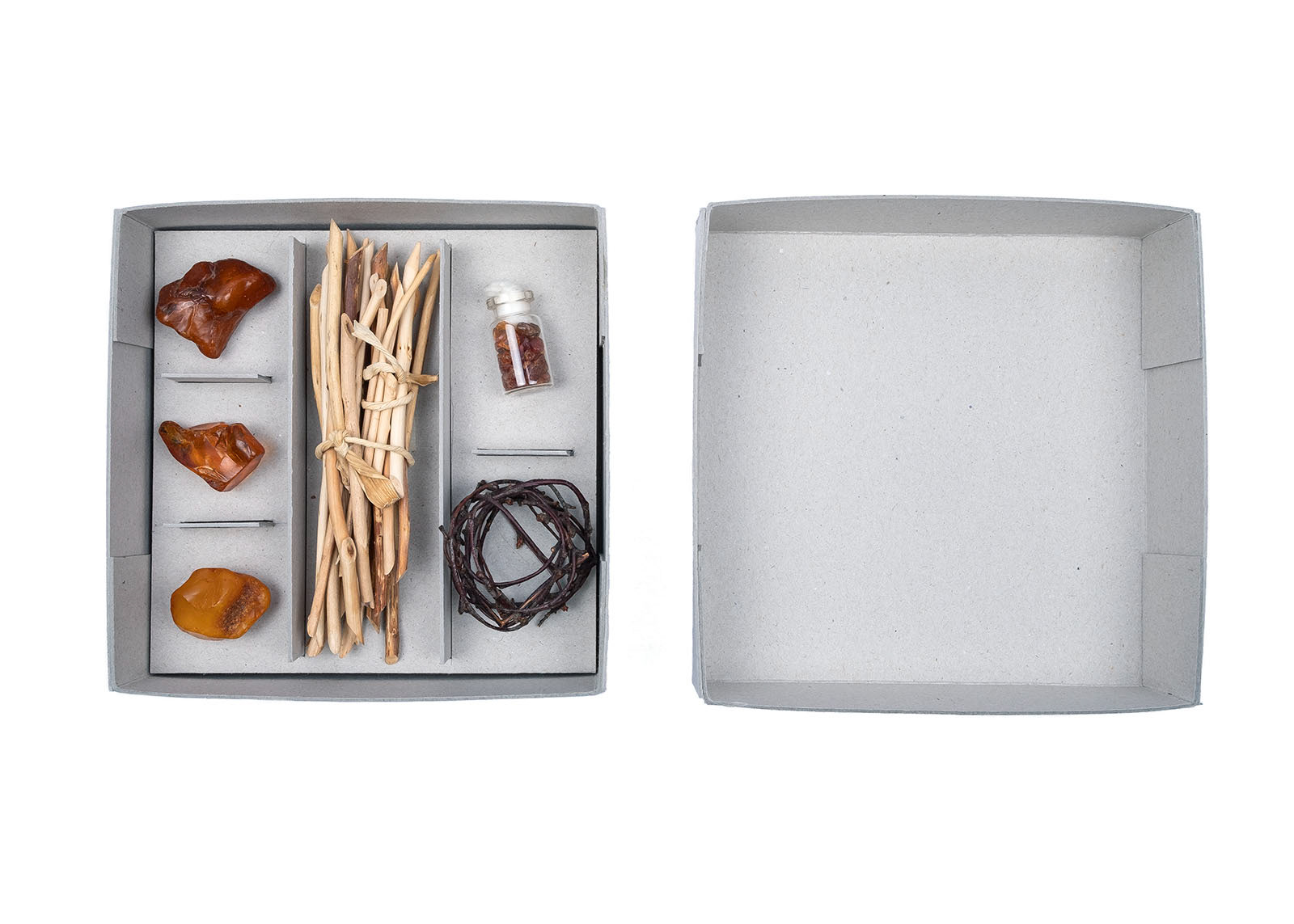Lene Bach-Lauritsen, picture of art piece: Tidsrum / Spaces of Time (2018). Cardboard, amber, wood, glass vial