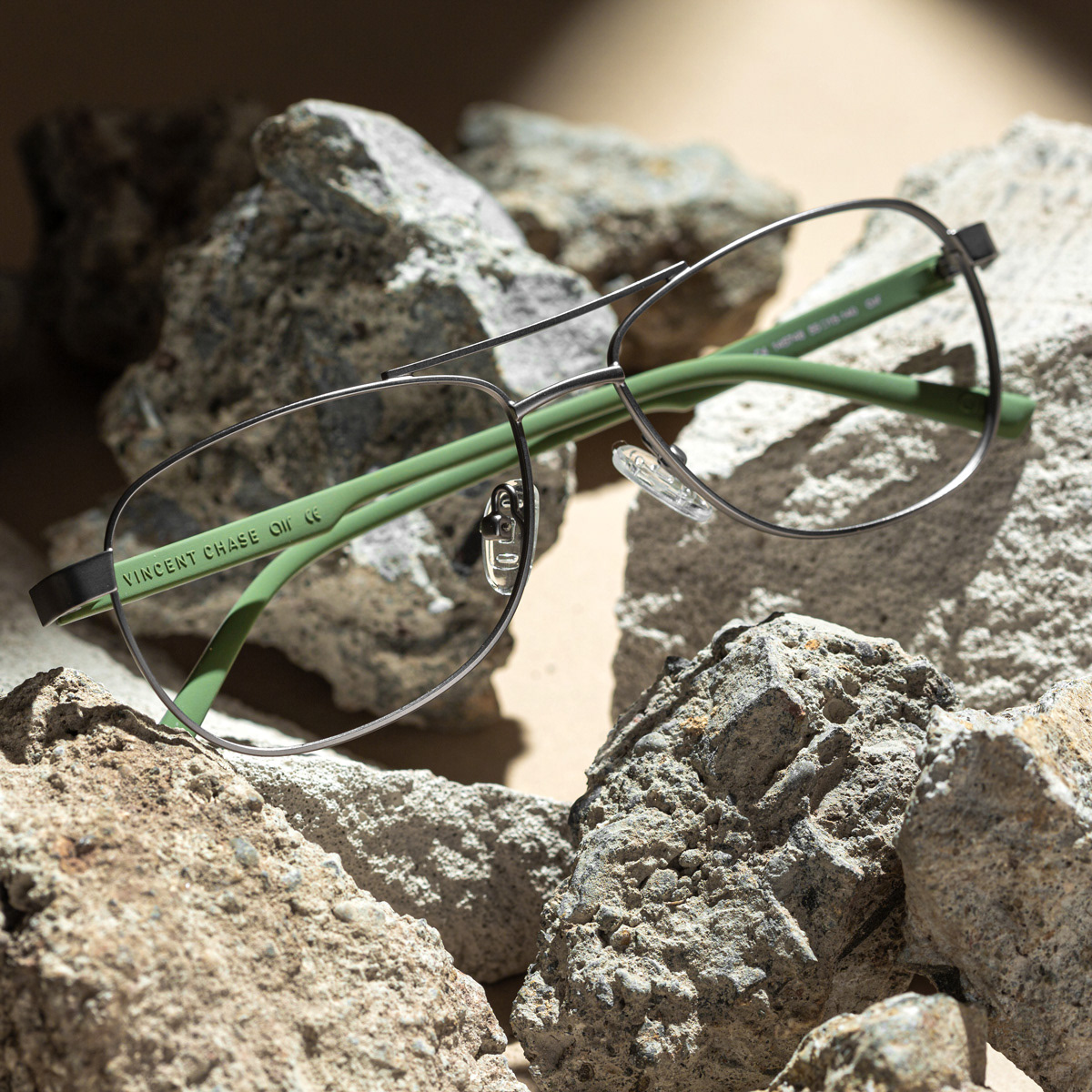 Eyewear on a bed of rocks giving it a rugged look