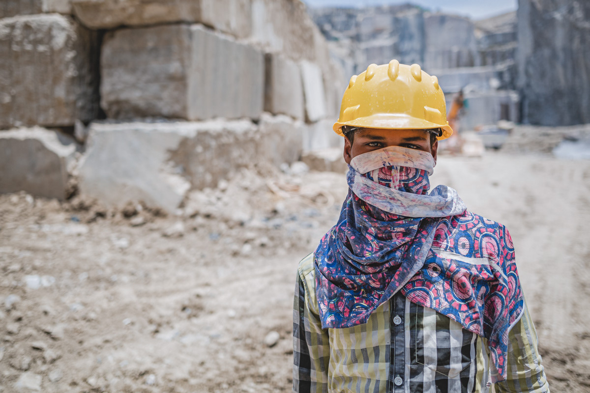 Quarry worker faced covered to prevent from dust