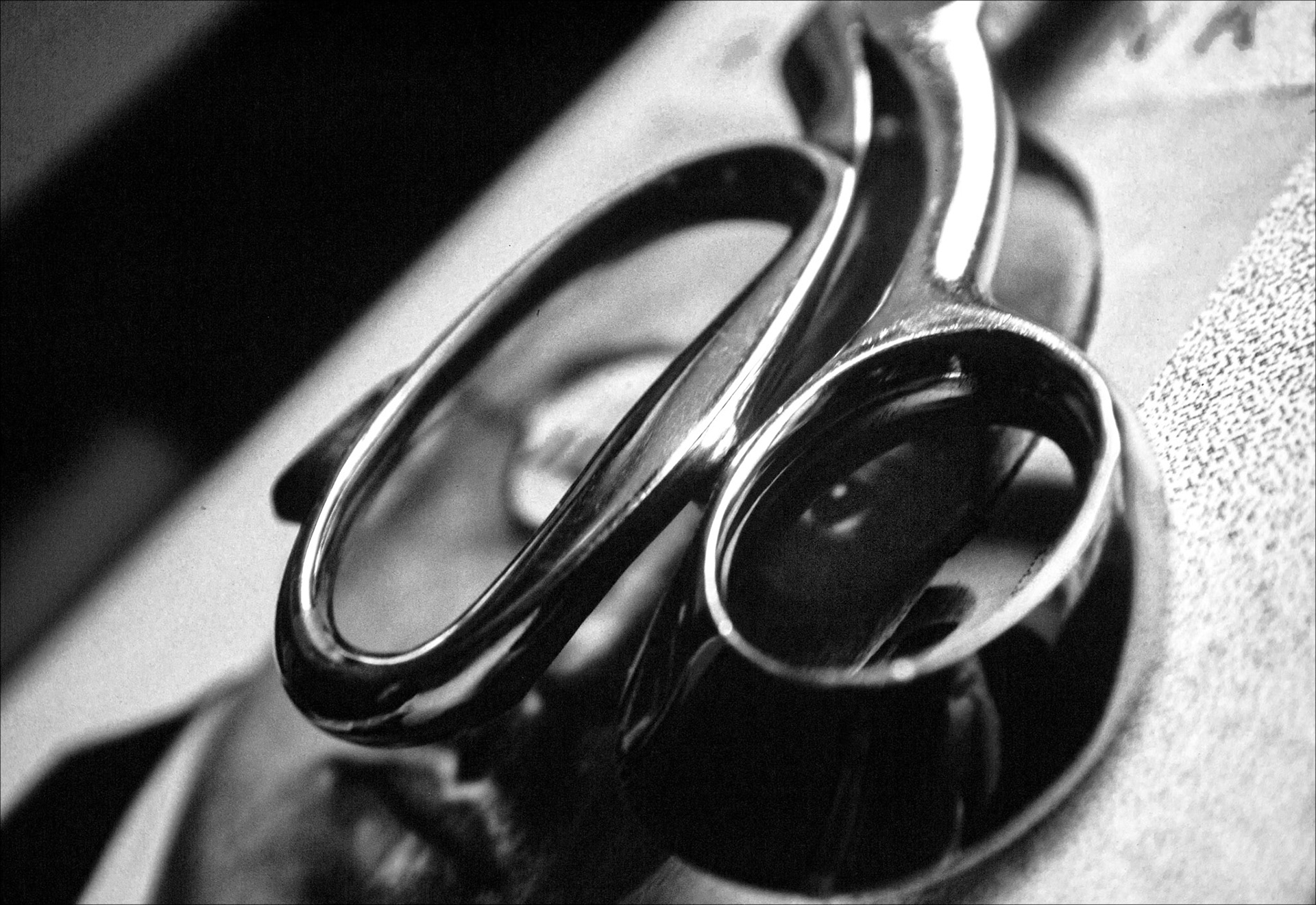 Composition merging object and portrait in a play of forms and reflections.