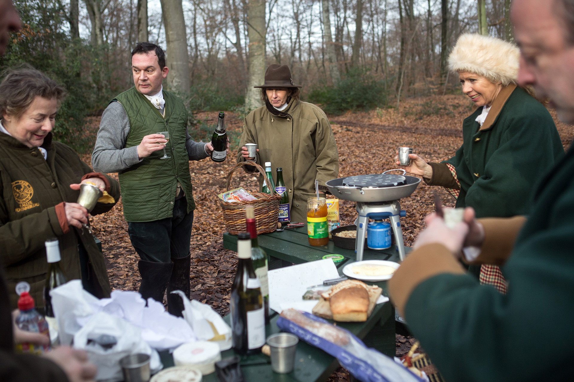 Members of the Fontainebleau rally picnic with champagne after hunting with hounds in the forest of Fontainebleau. Forbidden in most of the European countries (in Germany since 1952, in Belgium since 1995, in the Scotland since 2002, in England and in the Wales since 2004), hunting with hounds, despite its aristocratic origins, knows an unprecedented vitality in France.