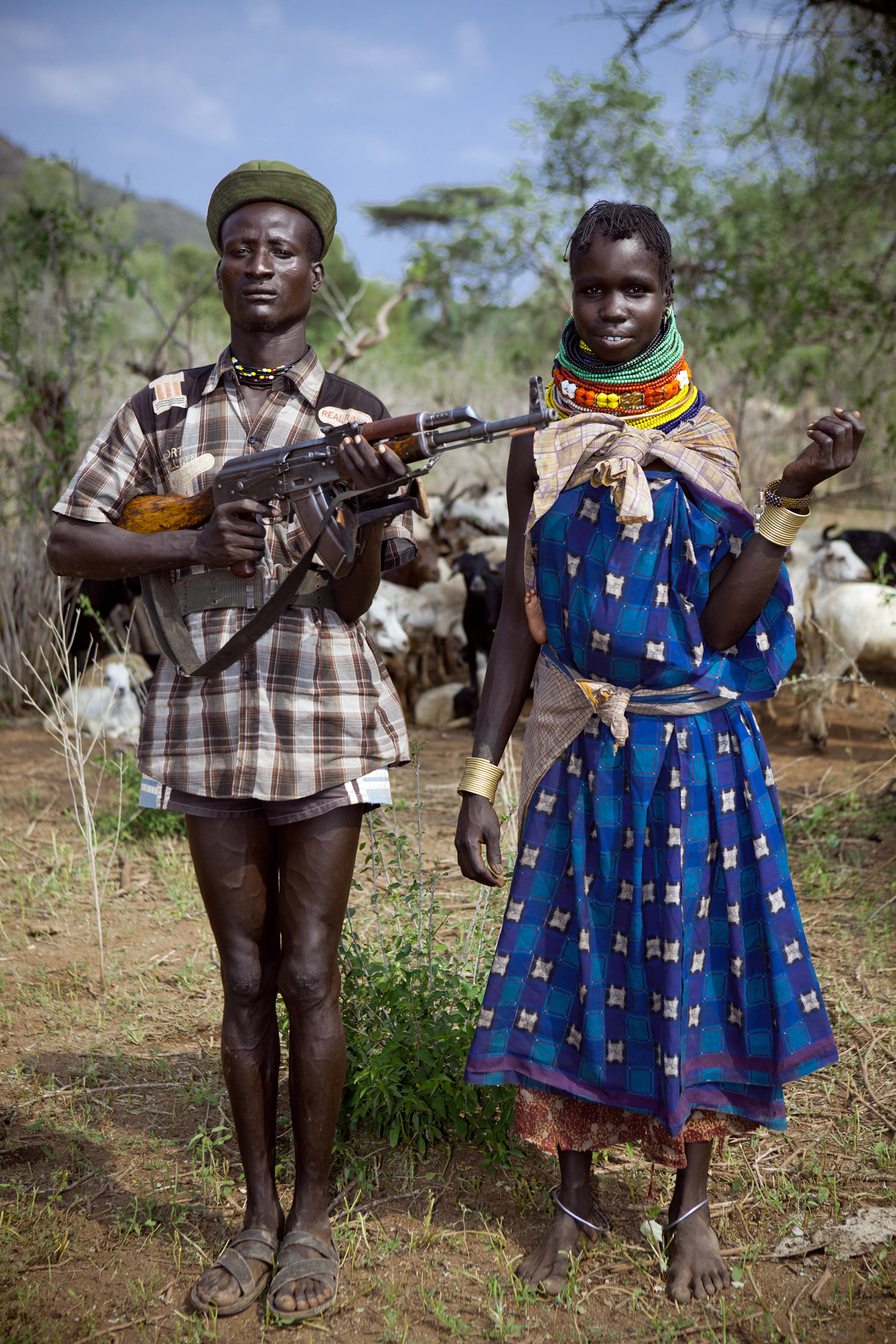 20 years old Lokalei Ekuwam has already killed 4 Toposas with his AK-47. Here with his wife Ajem.