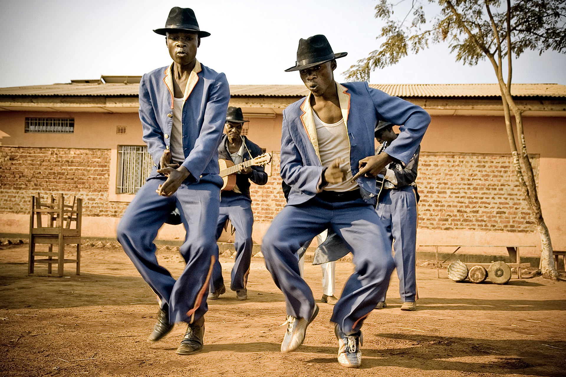 Tresor Kaluw et Joël Luya, dancers of the Jecoke, are performing during a public show organised in the suburbs of Lubumbashi.