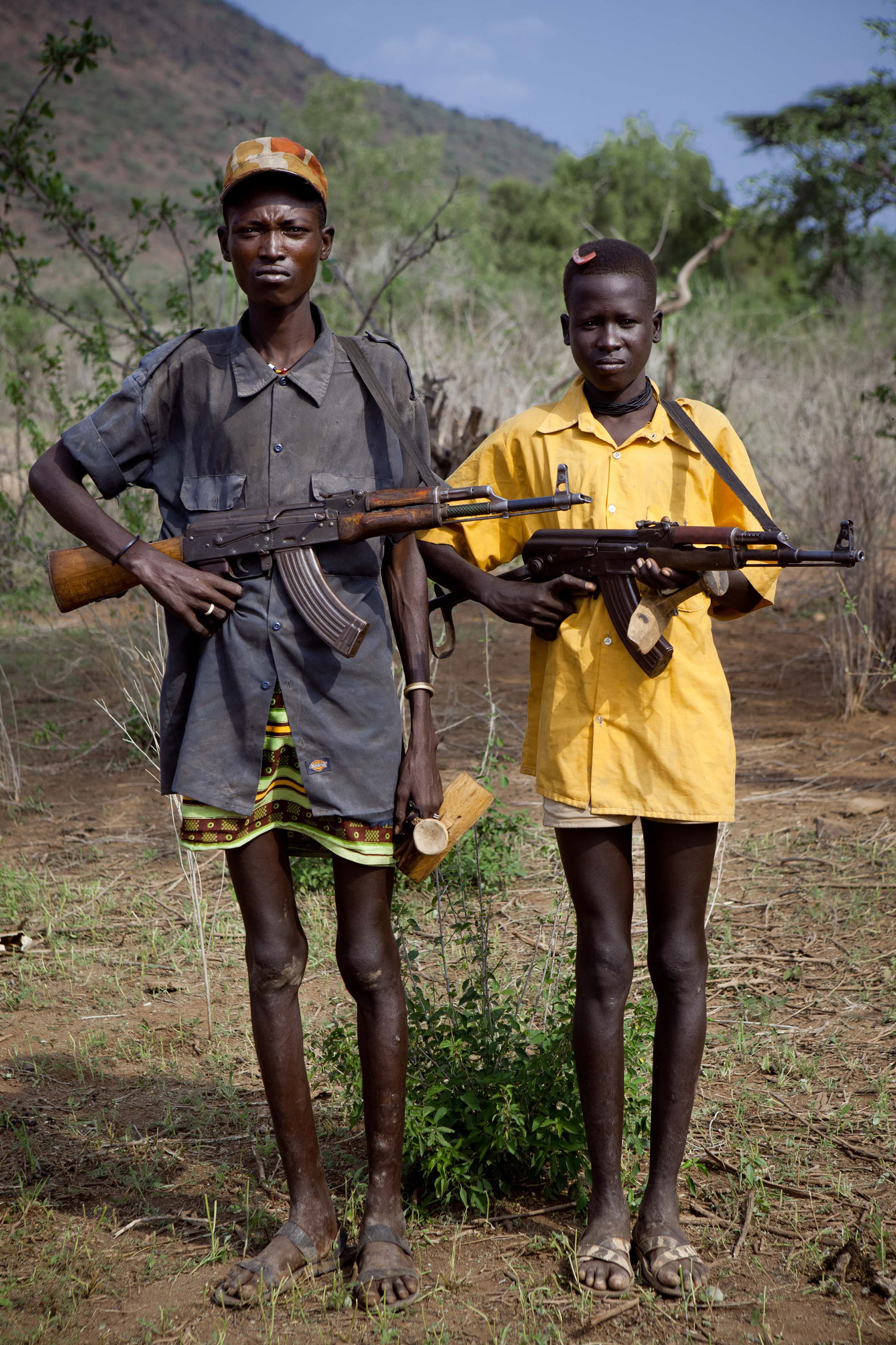 14 years old Lopua Ipacly and 12 years old Lokai Ekalapatan received their AK-47 of their fathers at the age of 10, so that they can defend their herds.