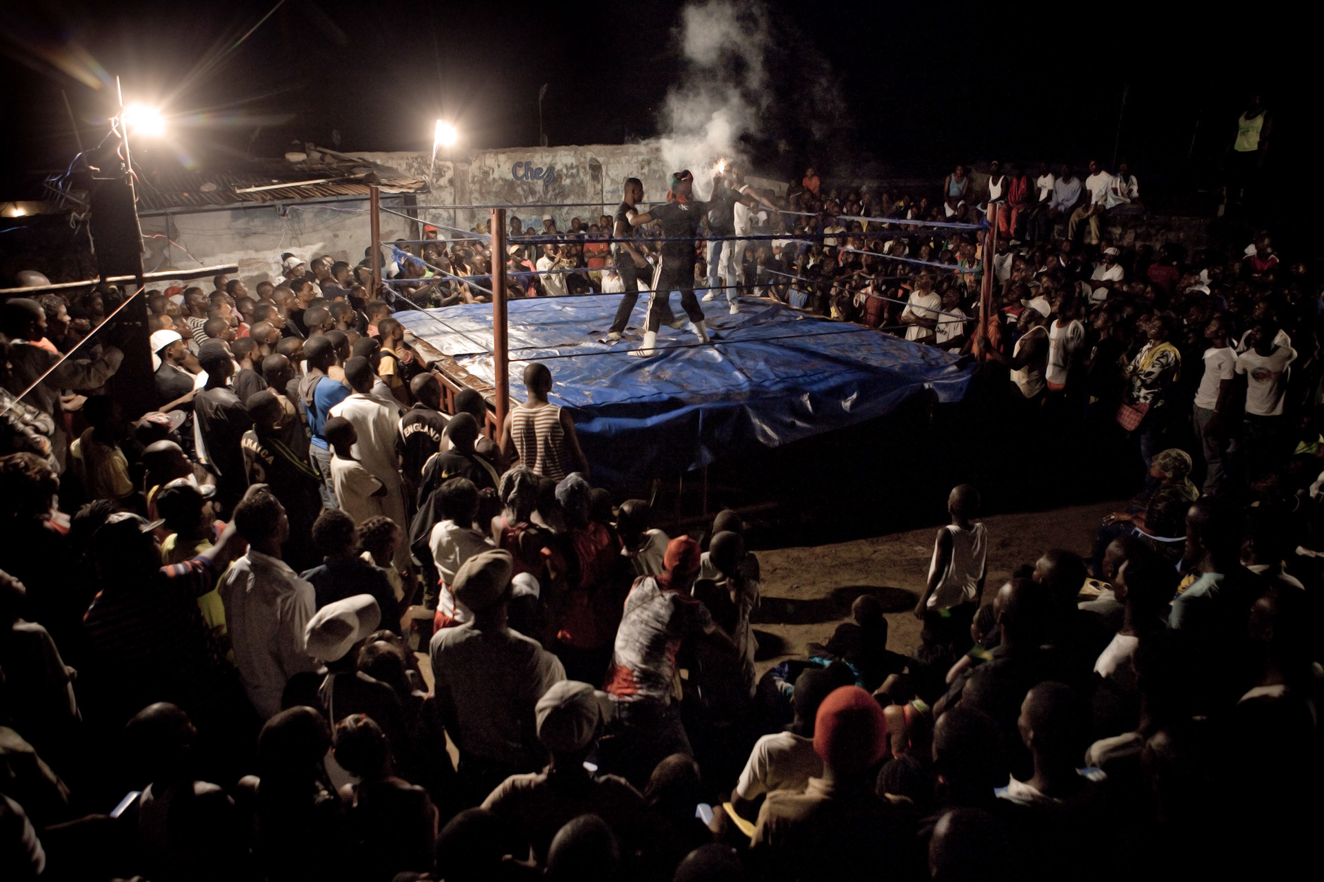 Spectators must pay 1000 Fc ($1) to attend a tournament like here in a private plot of Ndjili.