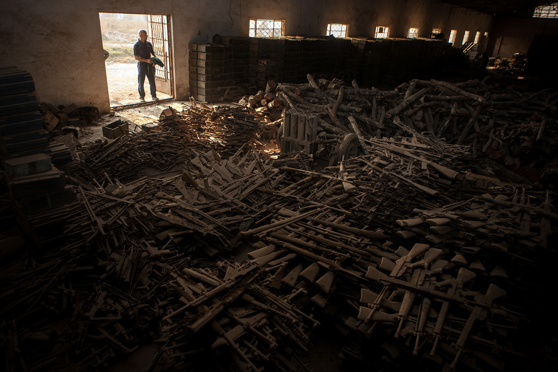 A padlocked chain and a "occasional" soldier protect the access to tens of thousand weapons and ammunitions stored in a disused factory in Lubumbashi, Katanga province, by the FARDC (Armed forces of the Democratic Republic of Congo).