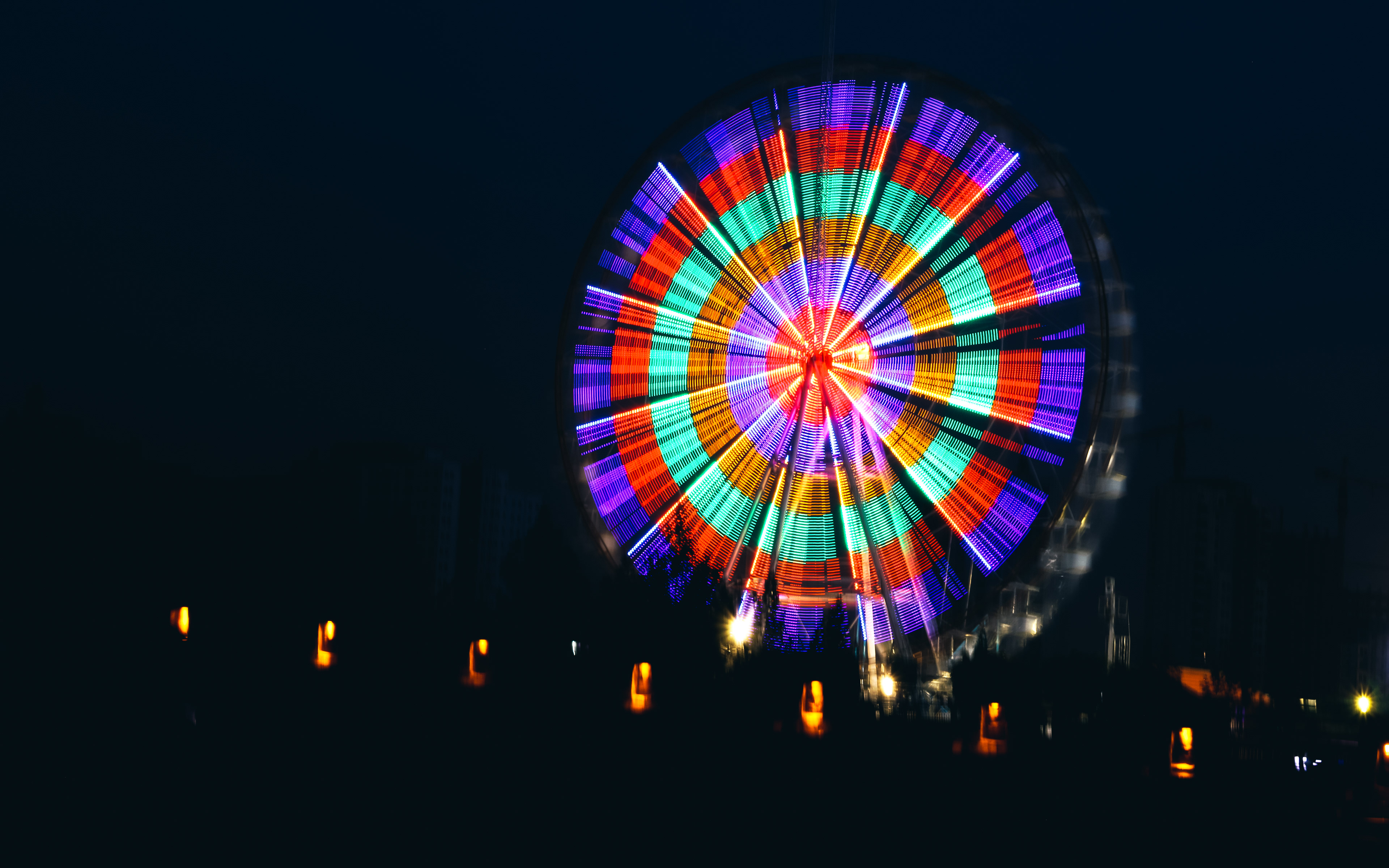 Iran, Tehran. Ferris wheel by night at Chitgar Lake, also called Lake of the Martyrs of the Persian Gulf.