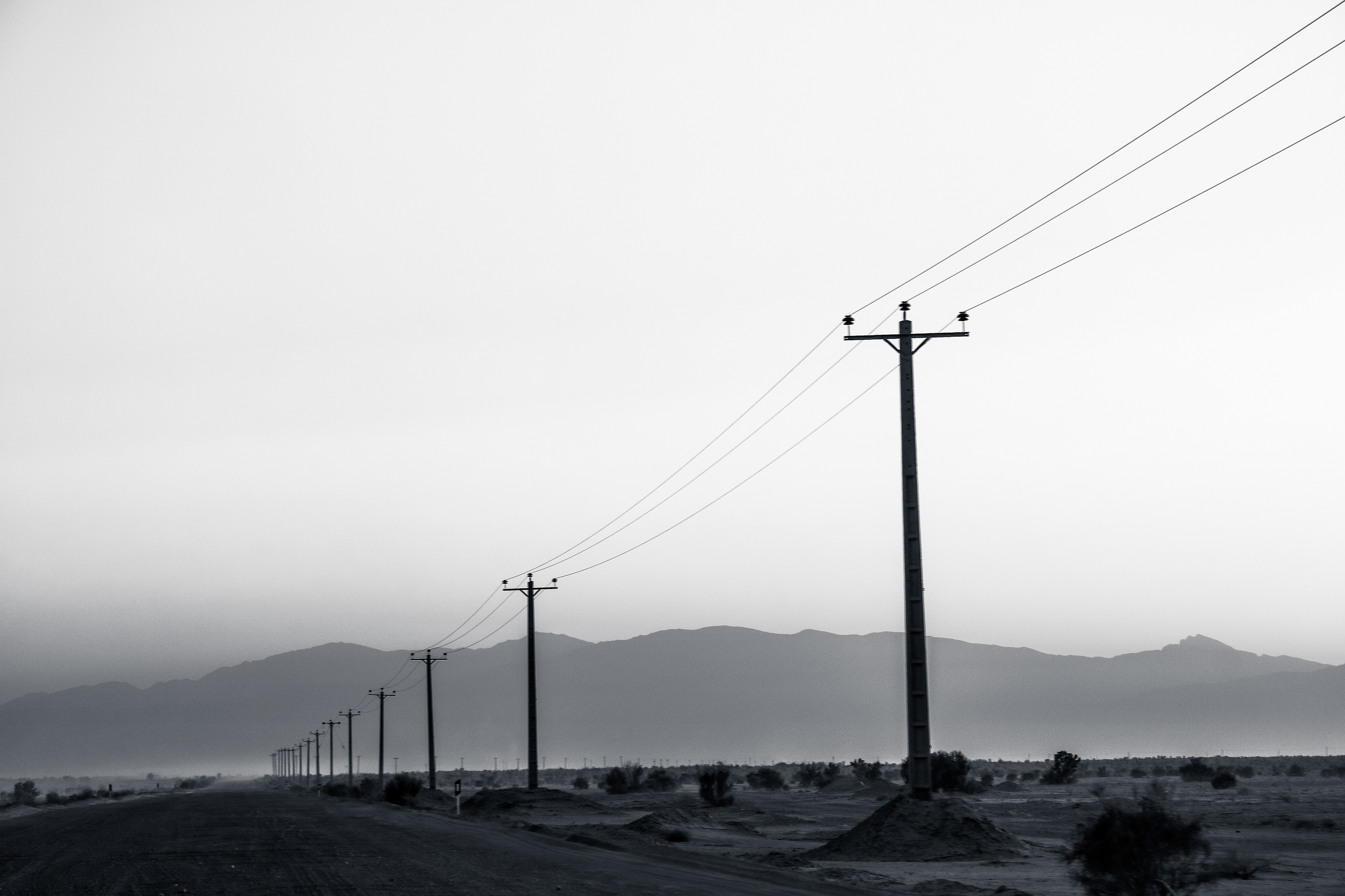 Iran, Isfahan Province. Misty sunset on the ride back from Maranjab Desert to Isfahan.