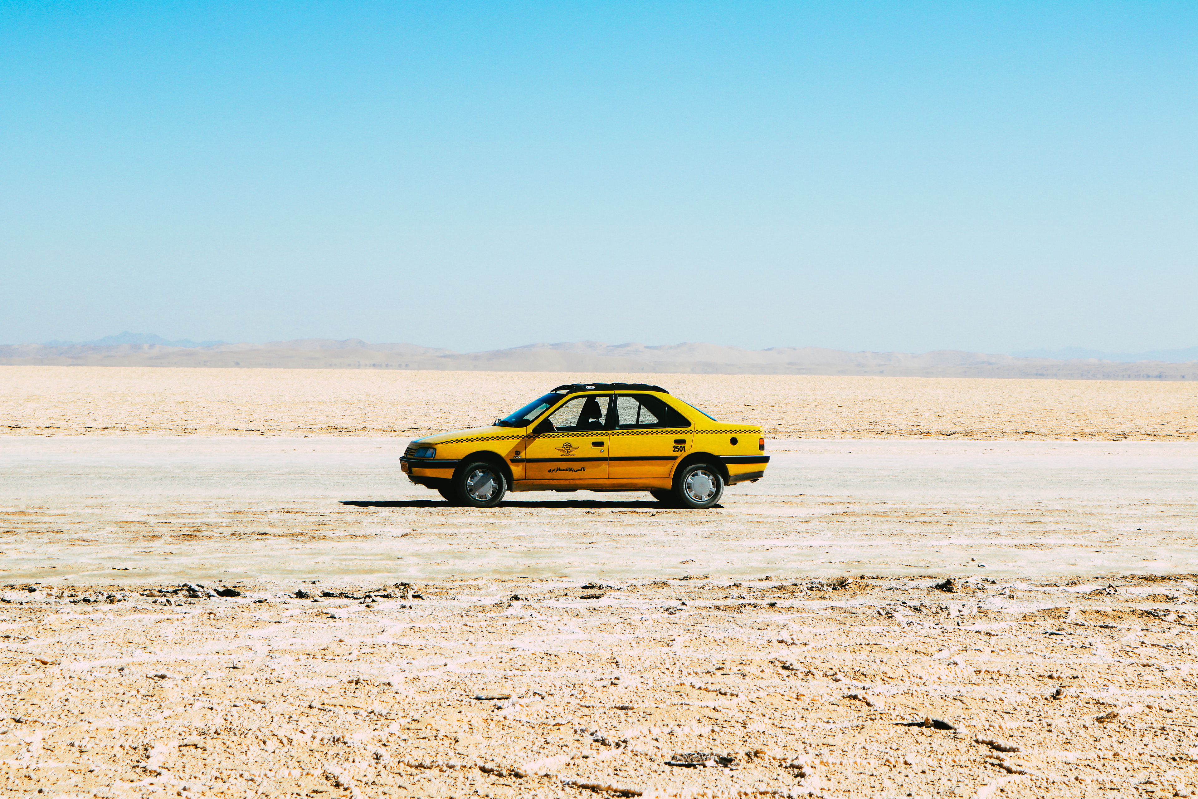 Iran, Kavir National Park. Taxi ride in the middle of the desert.