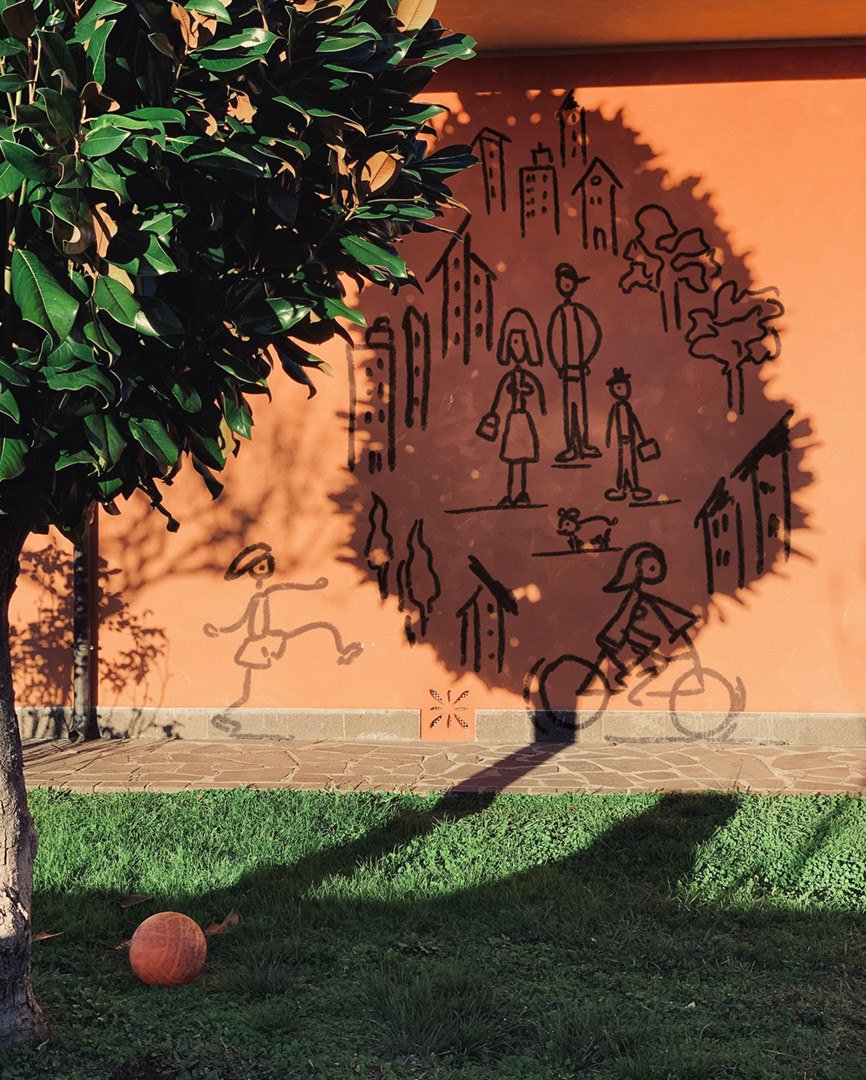 Sketch / illustration of a group of people / family on the wall of a house, where the shadow of a magnolia tree falls. *** The artwork was digitally superimposed and a release is provided ***