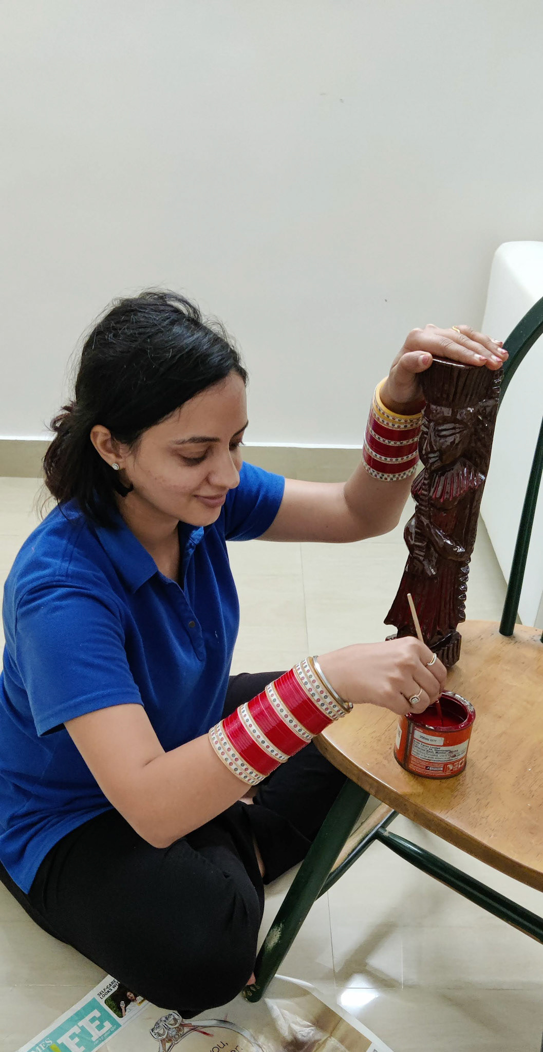Newly married. Skipped directly to my art attack at my husband's house.  Wearing traditional red bangles worn by a newly married North Indian bride