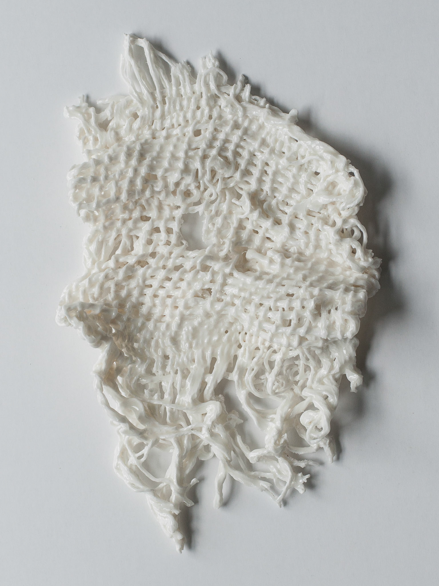 Porcelain. Woven with burlap on cotton, glazed, fired twice, 960°C, 1260°C