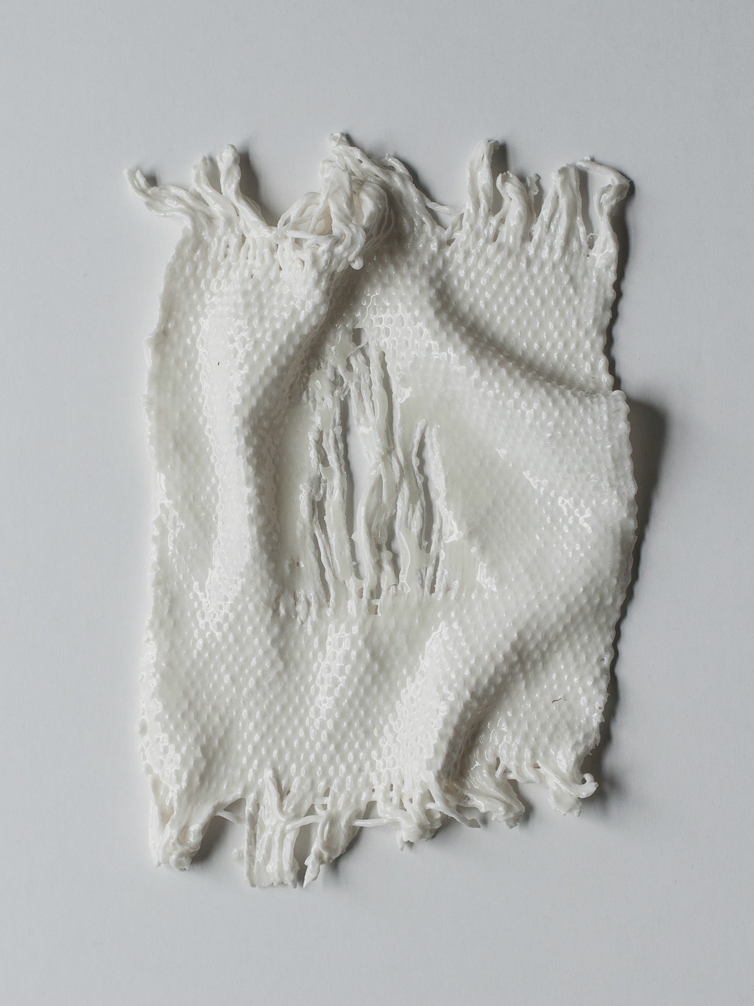 Porcelain. Woven with cotton on cotton, glazed, fired twice, 960°C, 1260°C