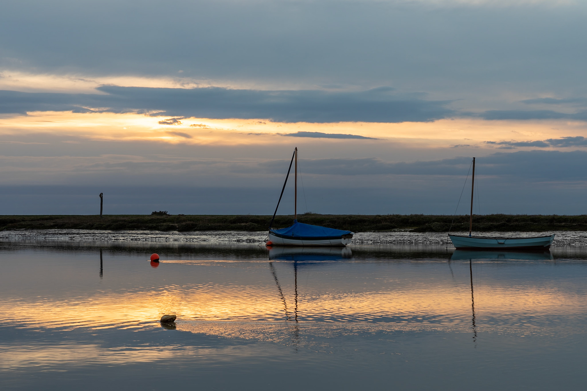 Sunset on the river estuary at Burnham Overy Staithe
