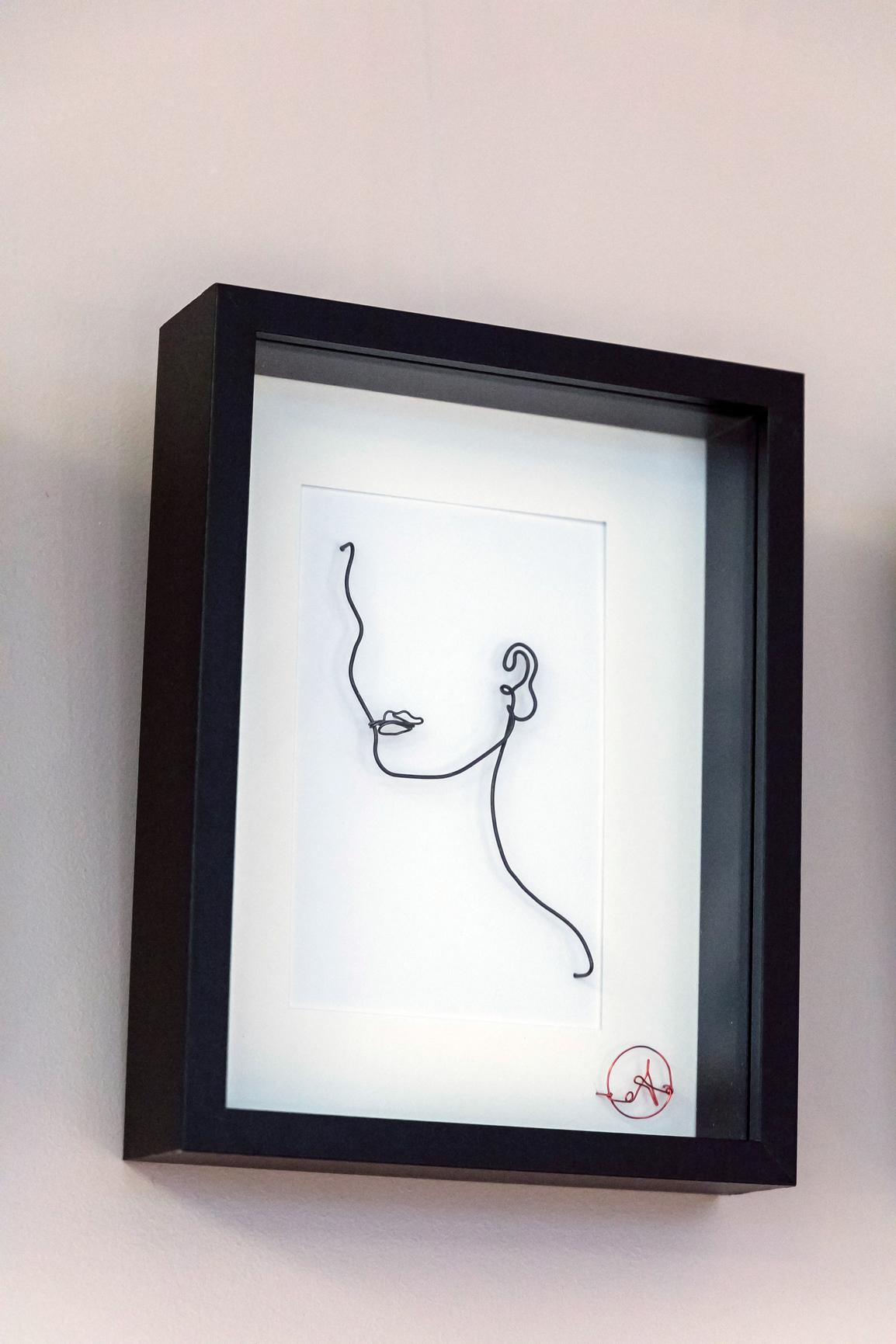 Cadre visage en fil de fer sculpté - 120€