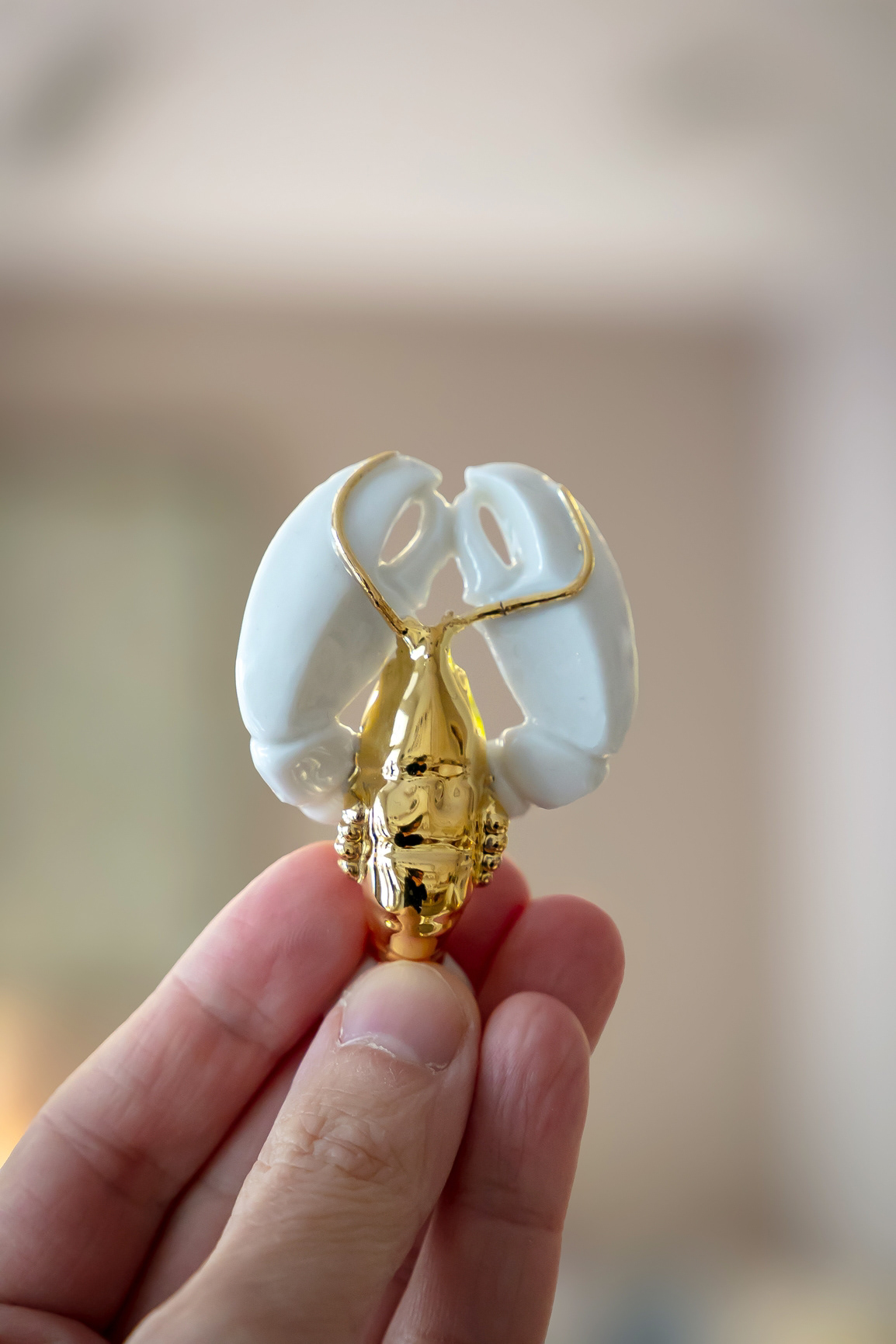 Porte couteaux homard en porcelaine et or - 40€ 