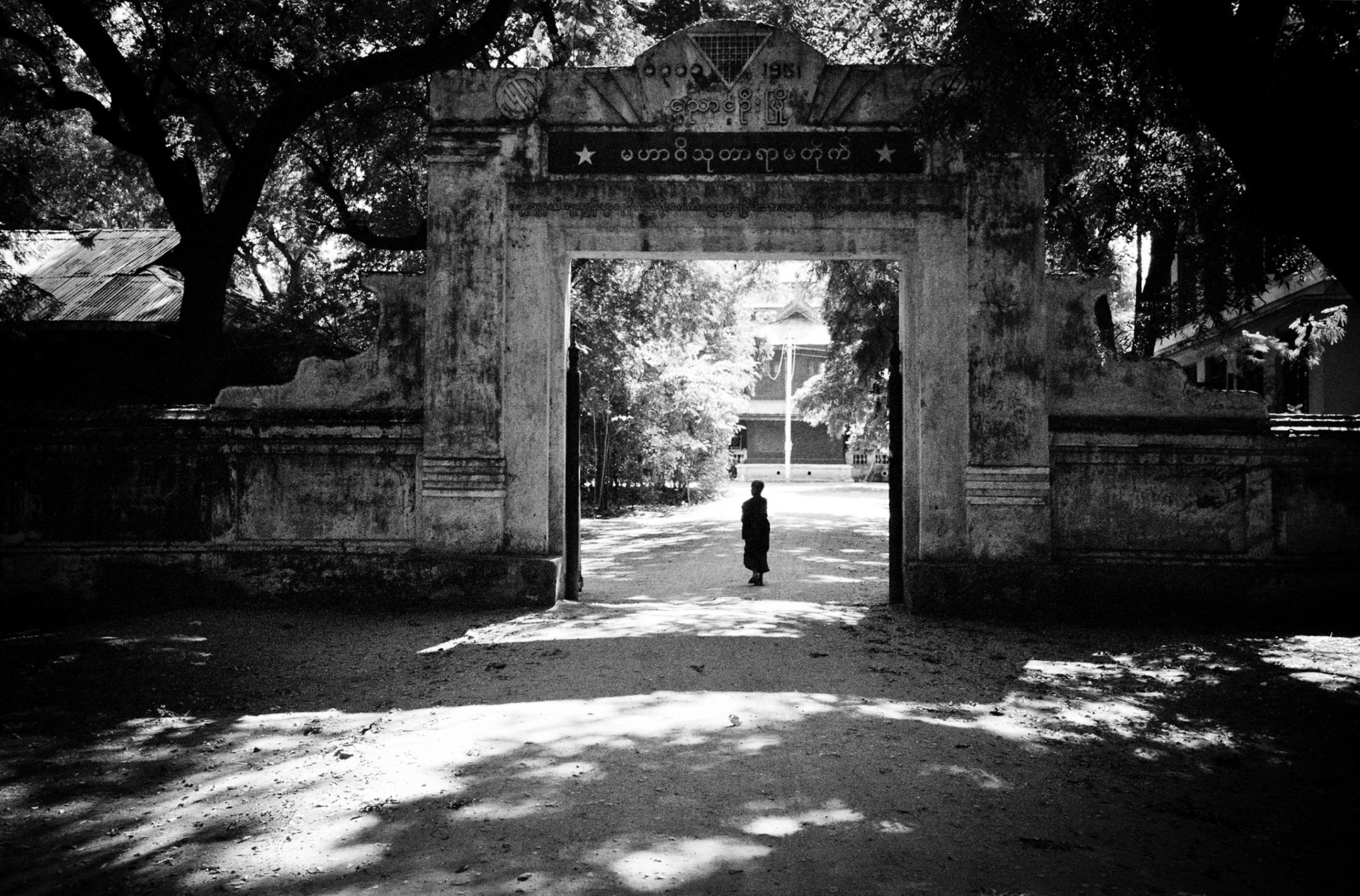 A novice monk stands at the entrance to his monastery in Bagan, the ancient city of Burma where the ruins of more than 4,000 temples and pagodas spread out over its 16 square mile plains.