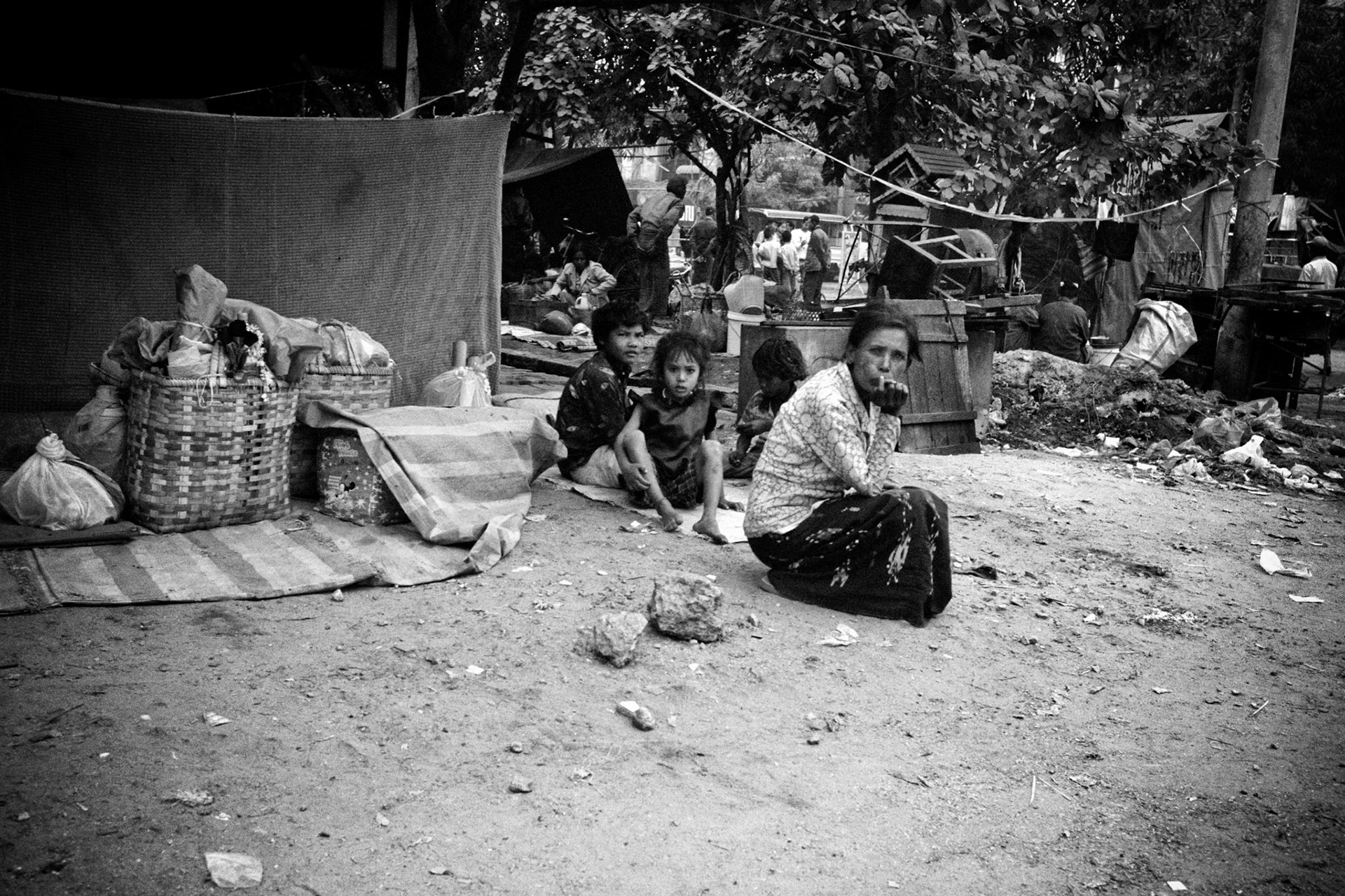 Homeless families living on the streets in Burma. Once a resource rich nation, Burma has become one of the poorest in the world with estimated more than 30% of the population living on or below the poverty line and where the ruling military regime spend less than 2% of GDP on education and healthcare combined.