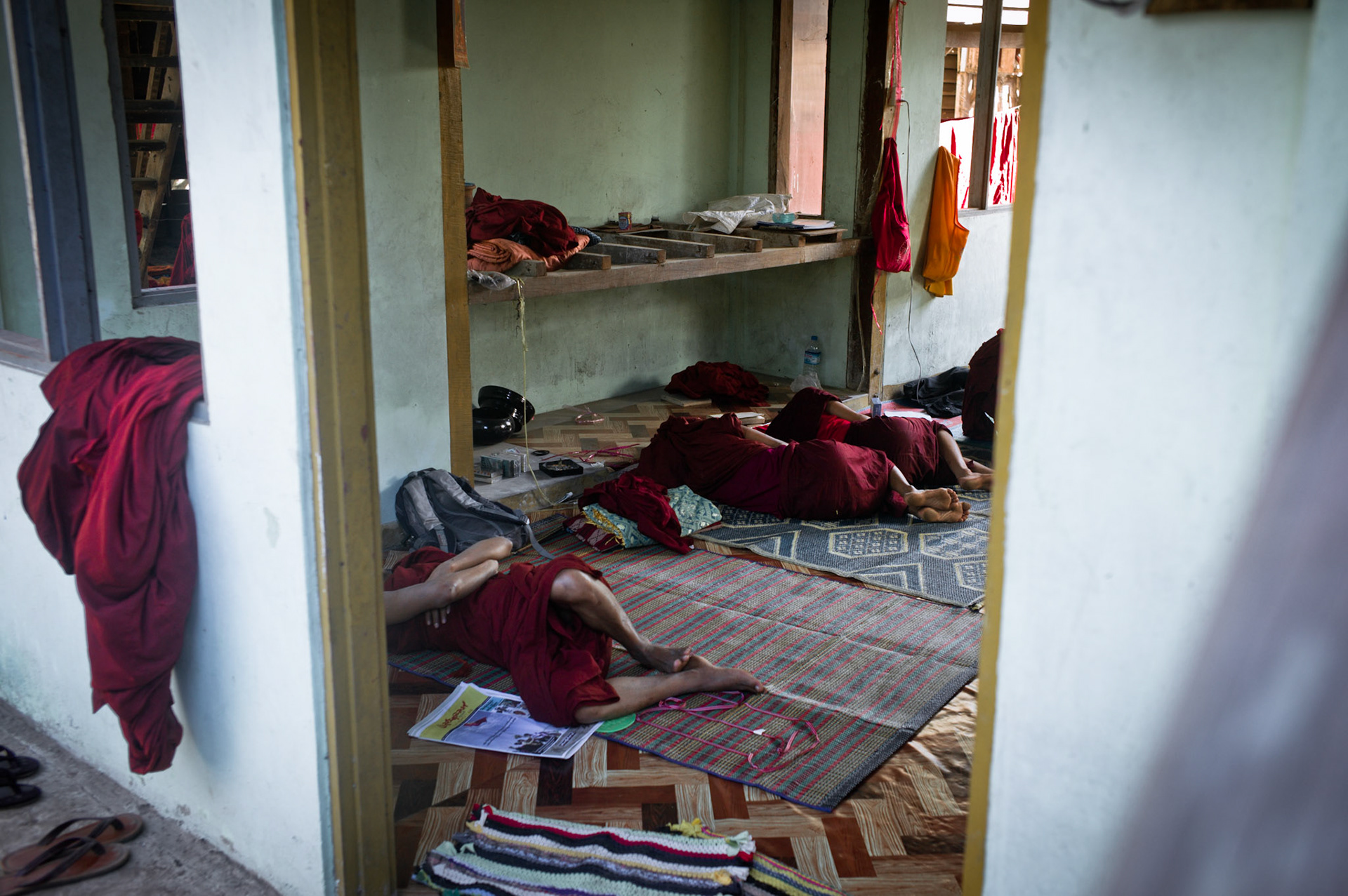 Novice monks and those who were arrested when the monastery was raided in September 2007 have now returned to Maggin. On September 26th 2007, at the height of Burma's monk led Saffron Revolution, Maggin Monastery in Rangoon, was raided as the regime commenced its brutal crackdown on the protests. On 13th January 2012 the monks were released from prison and more than four years since the monastery was raided and locked, they returned and opened the doors once more. Everything they found was exactly as it was left the night the military regime arrested them and ransacked the buildings.
