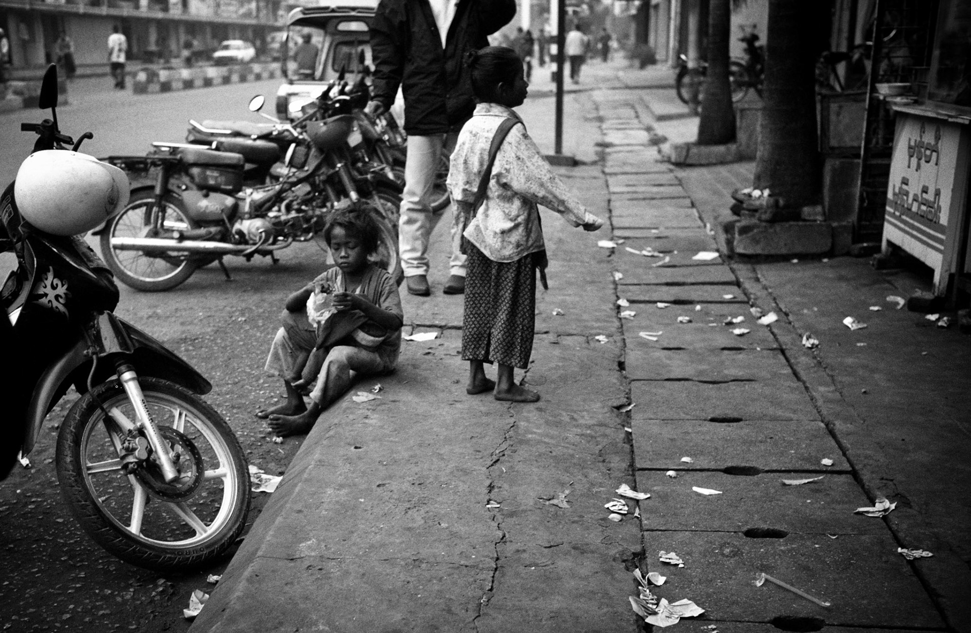 Young homeless children beg on the streets of Mandalay. Burma, a resource rich nation, has become one of the poorest in the world with estimated more than 30% of the population living on or below the poverty line and where the ruling military regime spend less than 2% of GDP on education and healthcare combined.