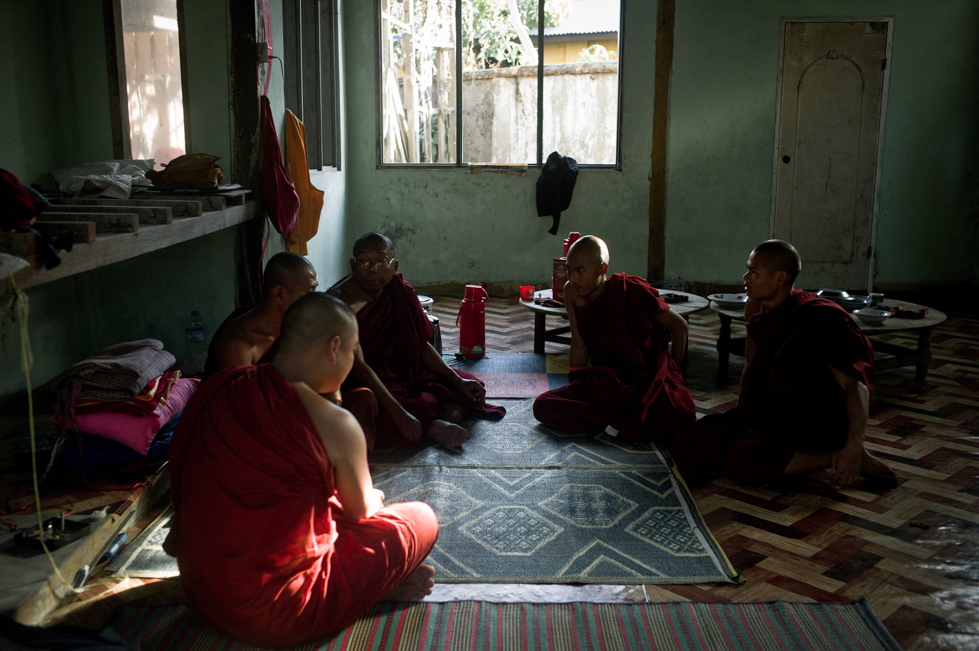 U Eindaka and his fellow monks who were also arrested in September 2007 talk with young novices who have just joined the monastery. On September 26th 2007, at the height of Burma's monk led Saffron Revolution, Maggin Monastery in Rangoon, was raided as the regime commenced its brutal crackdown on the protests. On 13th January 2012 the monks were released from prison and more than four years since the monastery was raided and locked, they returned and opened the doors once more. Everything they found was exactly as it was left the night the military regime arrested them and ransacked the buildings.