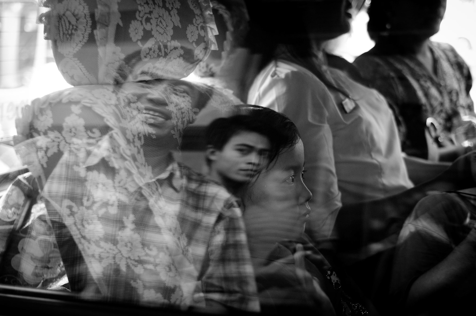 Phyu Nay Kyi, the five year old daughter of Ko Jimmy and Nilar Thein, sits next to her mother as they drive home together for the first time. The Presidential amnesty saw more than 600 political prisoners released from prison, many of who were former leaders of the mass democracy uprising in 1988 and were serving long sentences of 65 years or more.