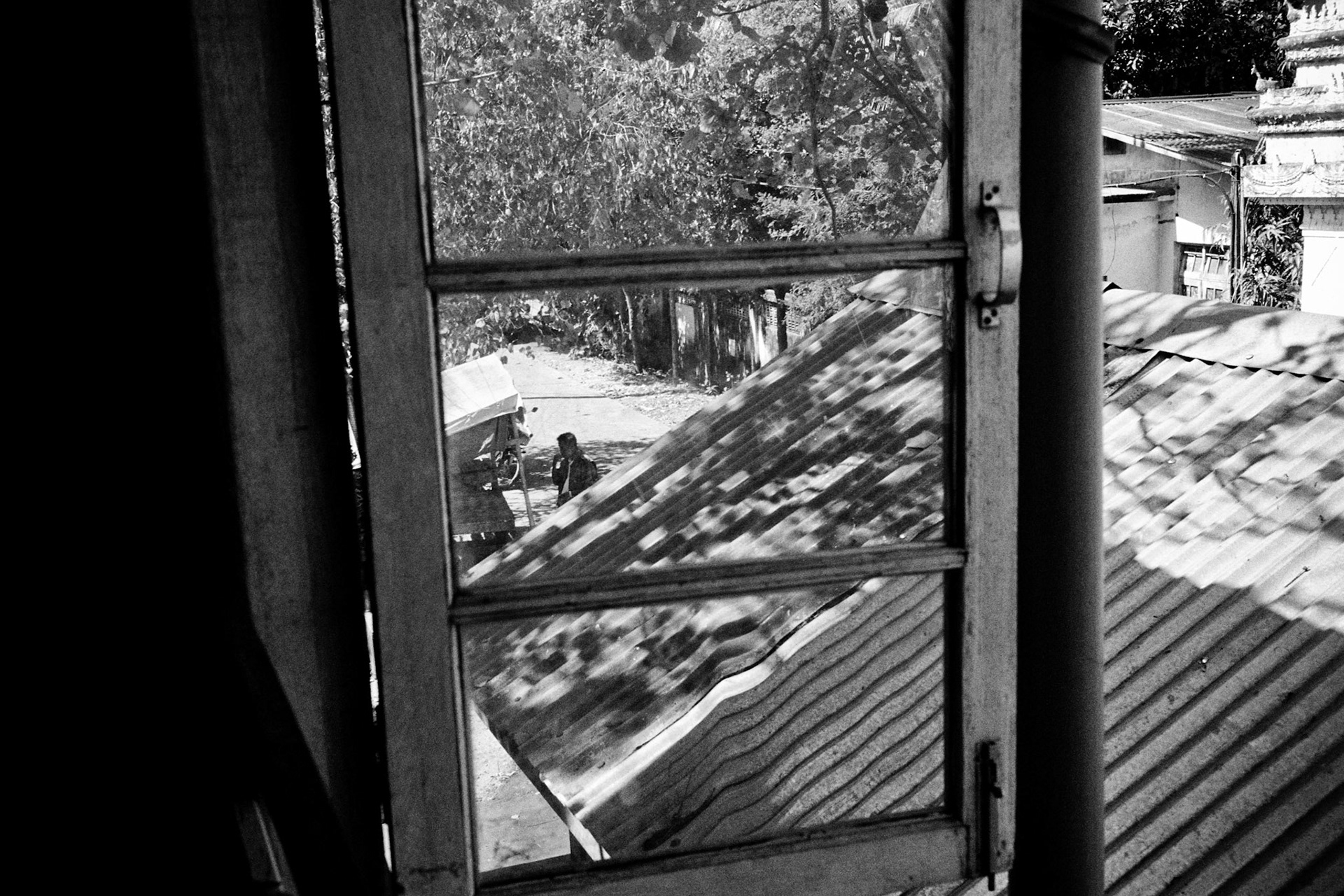 The military regime have thousands of militia thugs known as 'Swan Arr Shin' or 'Masters of Force' at their disposal to carry out attacks on people. Here members of Swan Arr Shin are stationed outside Ngwe Kyar Yan monastery keeping a close eye on anyone who comes near the now locked monastery.