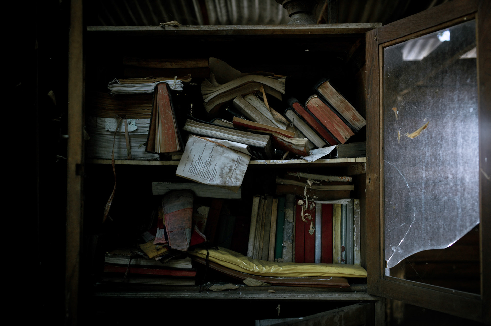 Religious books were ripped up and left scattered on the floor and cupboards were smashed open and turned over. On September 26th 2007, at the height of Burma's monk led Saffron Revolution, Maggin Monastery in Rangoon, was raided as the regime commenced its brutal crackdown on the protests. On 13th January 2012 the monks were released from prison and more than four years since the monastery was raided and locked, they returned and opened the doors once more. Everything they found was exactly as it was left the night the military regime arrested them and ransacked the buildings.
