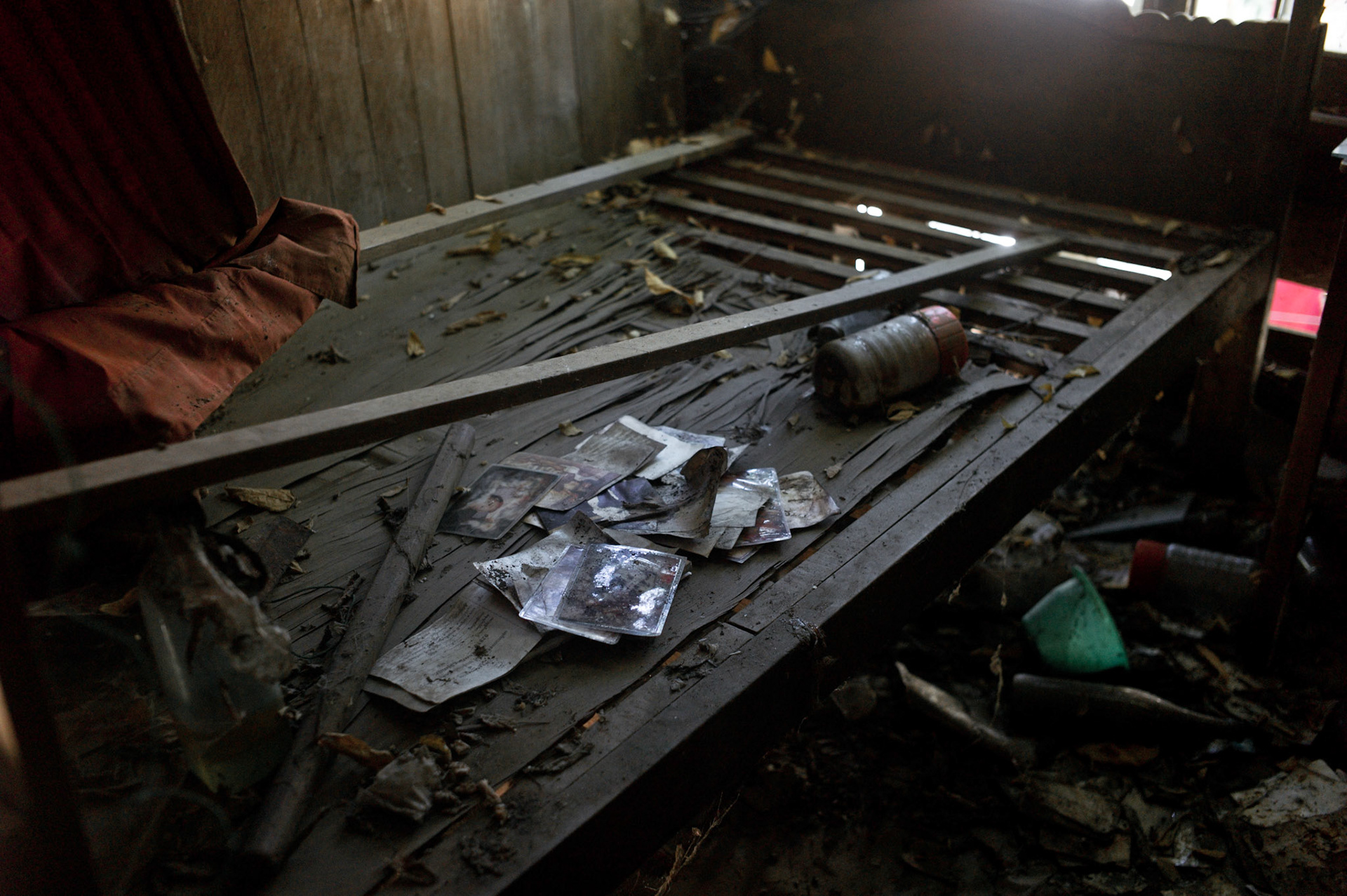 Photographs of friends and family lie scattered and decaying in U Eindaka's sleeping quarters that were completely destroyed by soldiers. On September 26th 2007, at the height of Burma's monk led Saffron Revolution, Maggin Monastery in Rangoon, was raided as the regime commenced its brutal crackdown on the protests. On 13th January 2012 the monks were released from prison and more than four years since the monastery was raided and locked, they returned and opened the doors once more. Everything they found was exactly as it was left the night the military regime arrested them and ransacked the buildings.