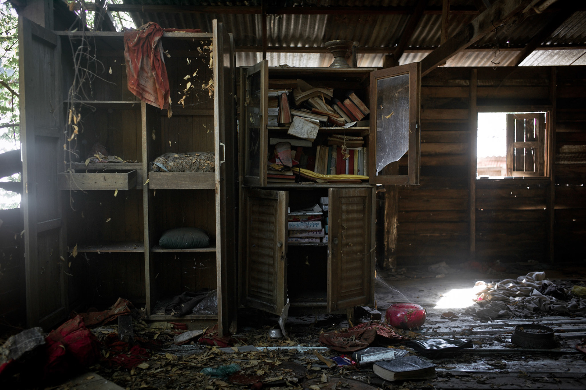Religious books and artefacts were torn from shelves and cupboards as military intelligence searched for evidence of the monks involvement in the Saffron Revolution. On September 26th 2007, at the height of Burma's monk led Saffron Revolution, Maggin Monastery in Rangoon, was raided as the regime commenced its brutal crackdown on the protests. On 13th January 2012 the monks were released from prison and more than four years since the monastery was raided and locked, they returned and opened the doors once more. Everything they found was exactly as it was left the night the military regime arrested them and ransacked the buildings.