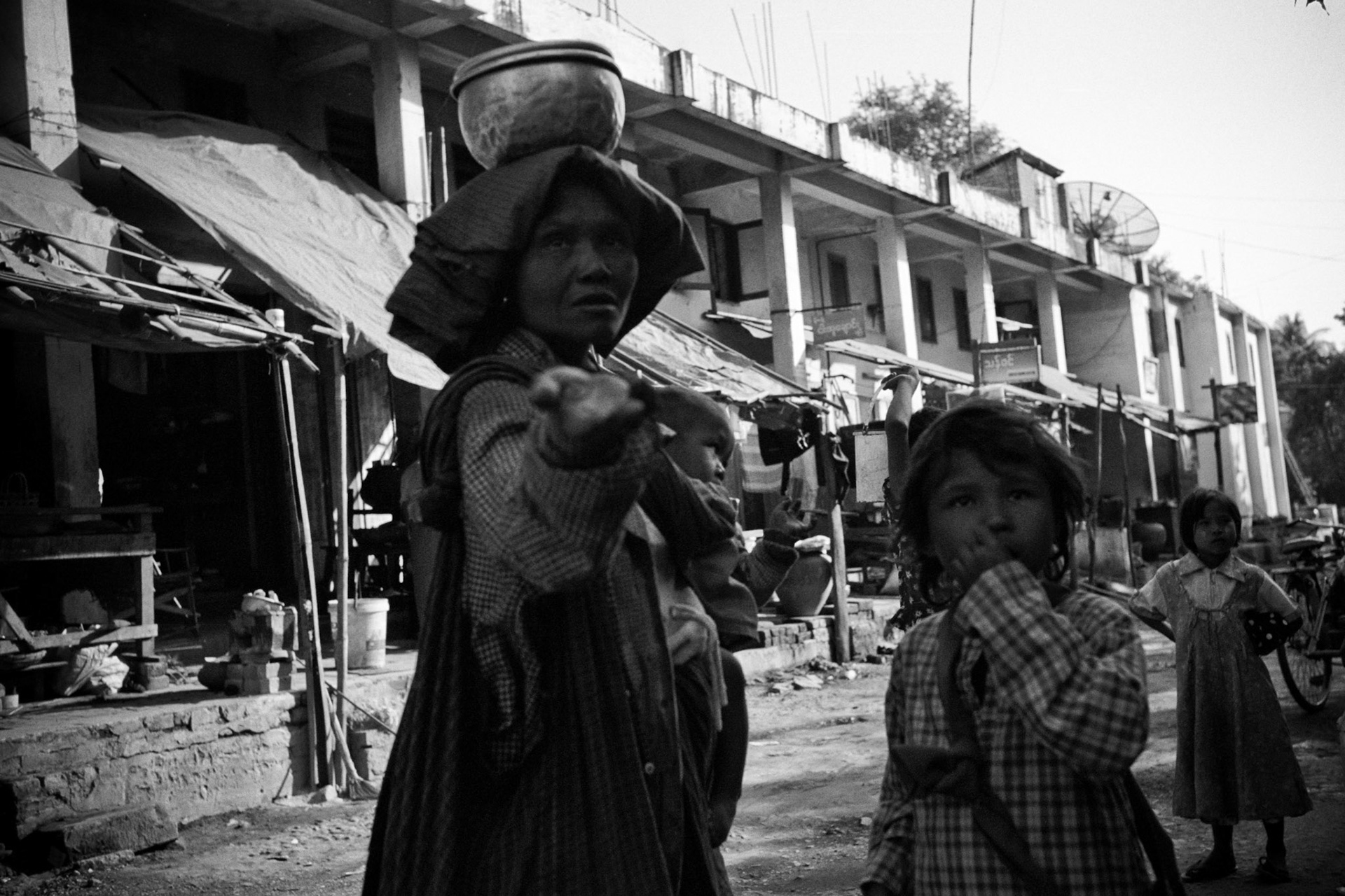 An old woman and her grand-daughter beg on the street sof Monywa. Burma, a resource rich nation, has become one of the poorest in the world with estimated more than 30% of the population living on or below the poverty line and where the ruling military regime spend less than 2% of GDP on education and healthcare combined.
