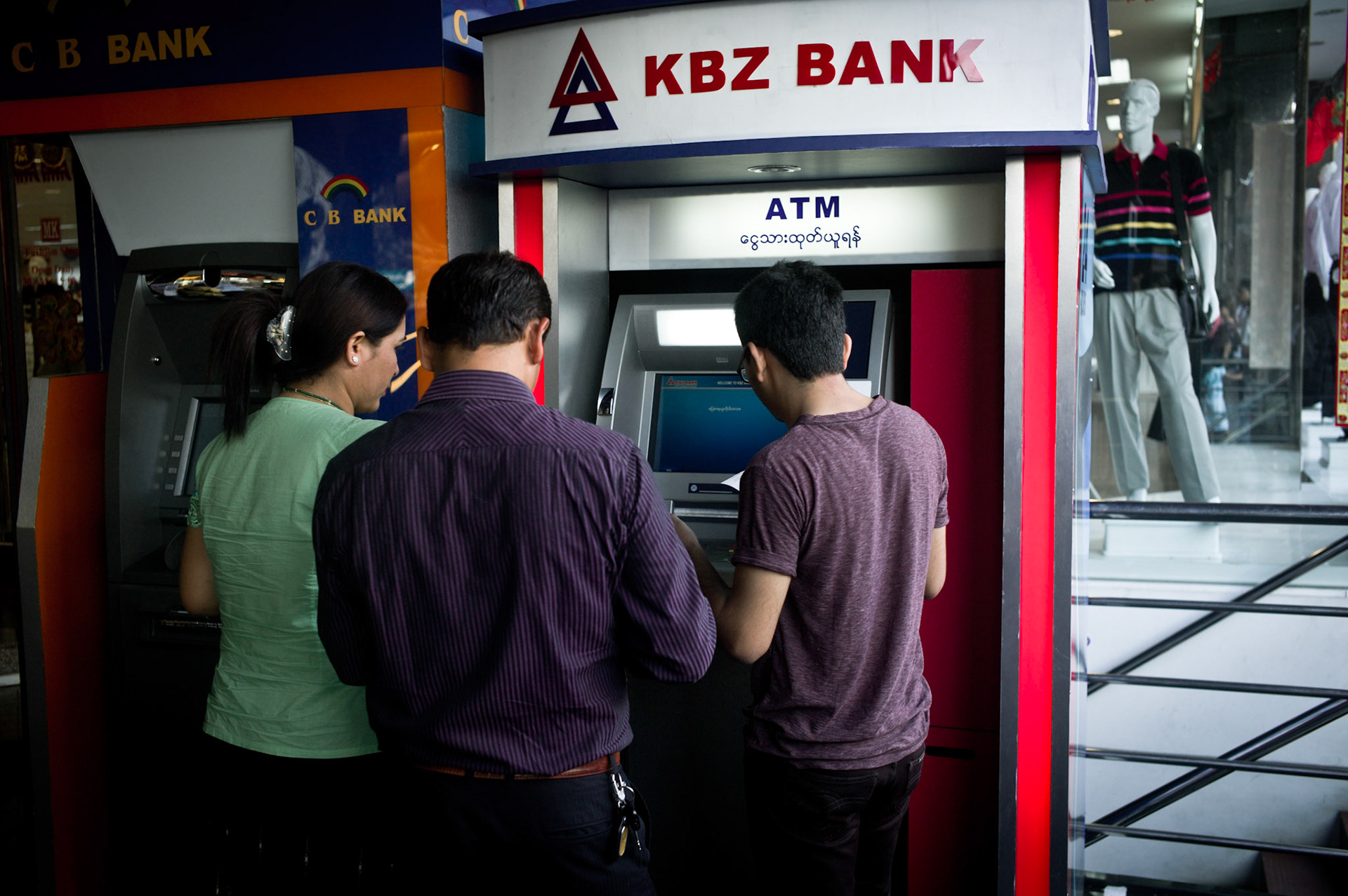 An ATM machine for KBZ bank is opened in downtown Rangoon. The financial system in Burma has collapsed numerous times over the past decades, most notably in 1988 when the currency was devalued overnight. The black market has historically dictated the exchange rate but recent reforms have lead to an official exchange rate finally being launched in April 2012 and discussions with the IMF and World Bank take place as the government desperately tries to entice foreign investment