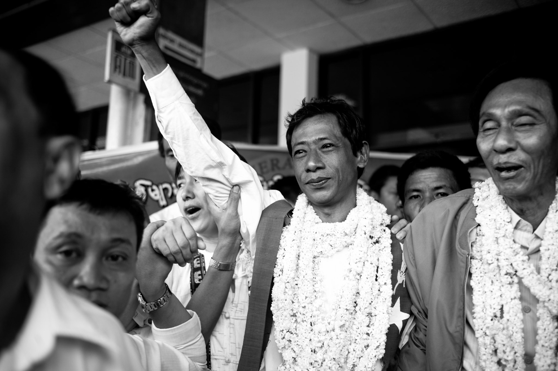 One of Burma's most prominent political dissidents, 88 Generation Student leader Htay Kywe raises his fist in the air to salute waiting crowds as and the release of his colleagues from prison. Htay Kywe was serving a prison sentence of 65 years before being released along with more than 600 other political prisoners under a presidential amnesty.