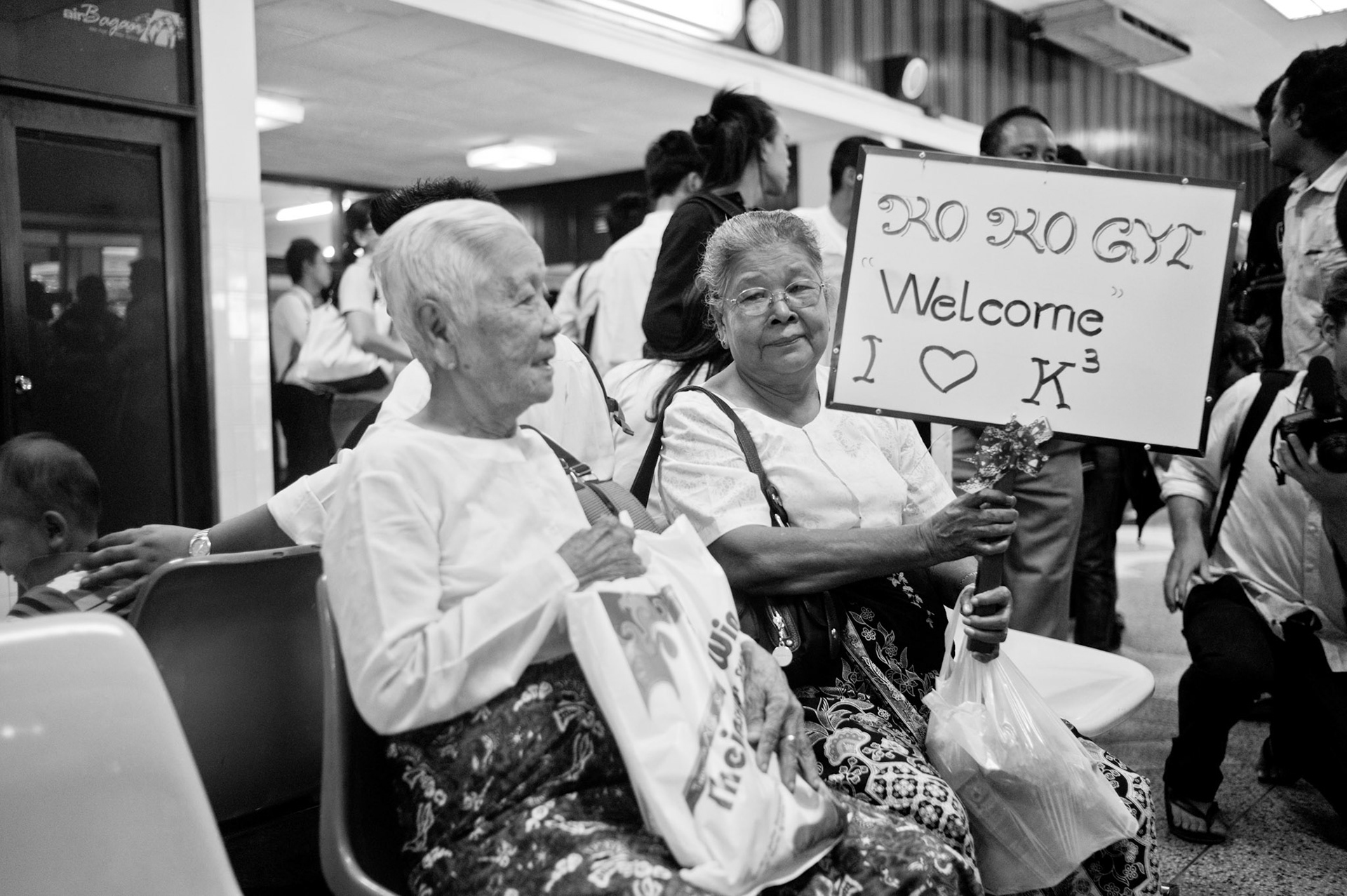 88 Generation Student leader Ko Ko Gyi's mother awaits his arrival at Rangoon airport. The Presidential amnesty saw more than 600 political prisoners released from prison, many of who were former leaders of the mass democracy uprising in 1988 and were serving long sentences of 65 years or more.