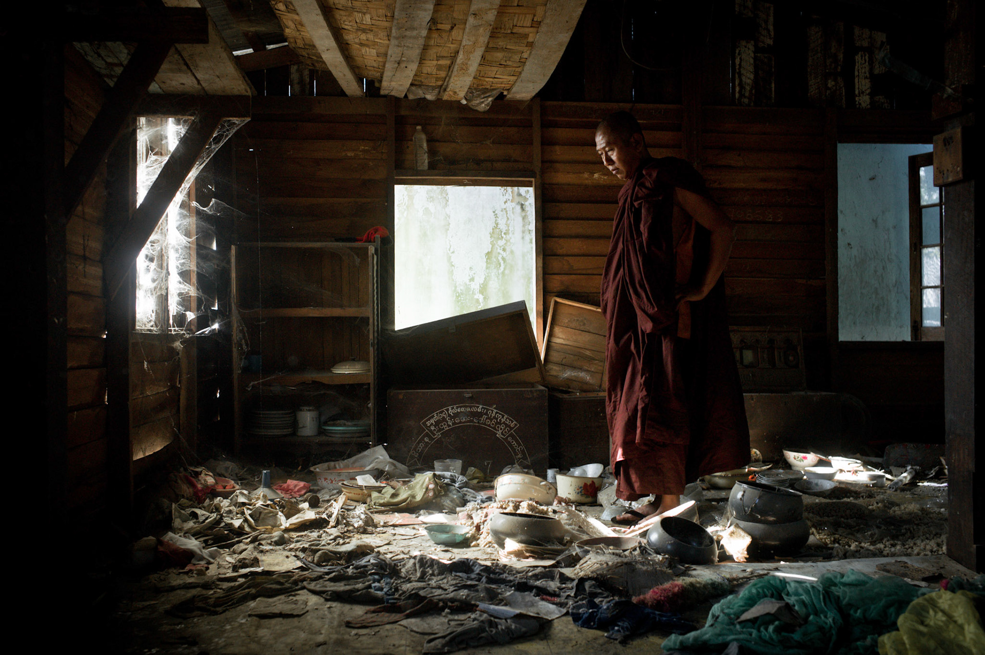 U Eindaka, the abbot of Maggin monastery, stands in the middle of a room surveying the remnants of the devastation caused four years ago when he and his fellow monks were arrested. On September 26th 2007, at the height of Burma's monk led Saffron Revolution, Maggin Monastery in Rangoon, was raided as the regime commenced its brutal crackdown on the protests. On 13th January 2012 the monks were released from prison and more than four years since the monastery was raided and locked, they returned and opened the doors once more. Everything they found was exactly as it was left the night the military regime arrested them and ransacked the buildings.