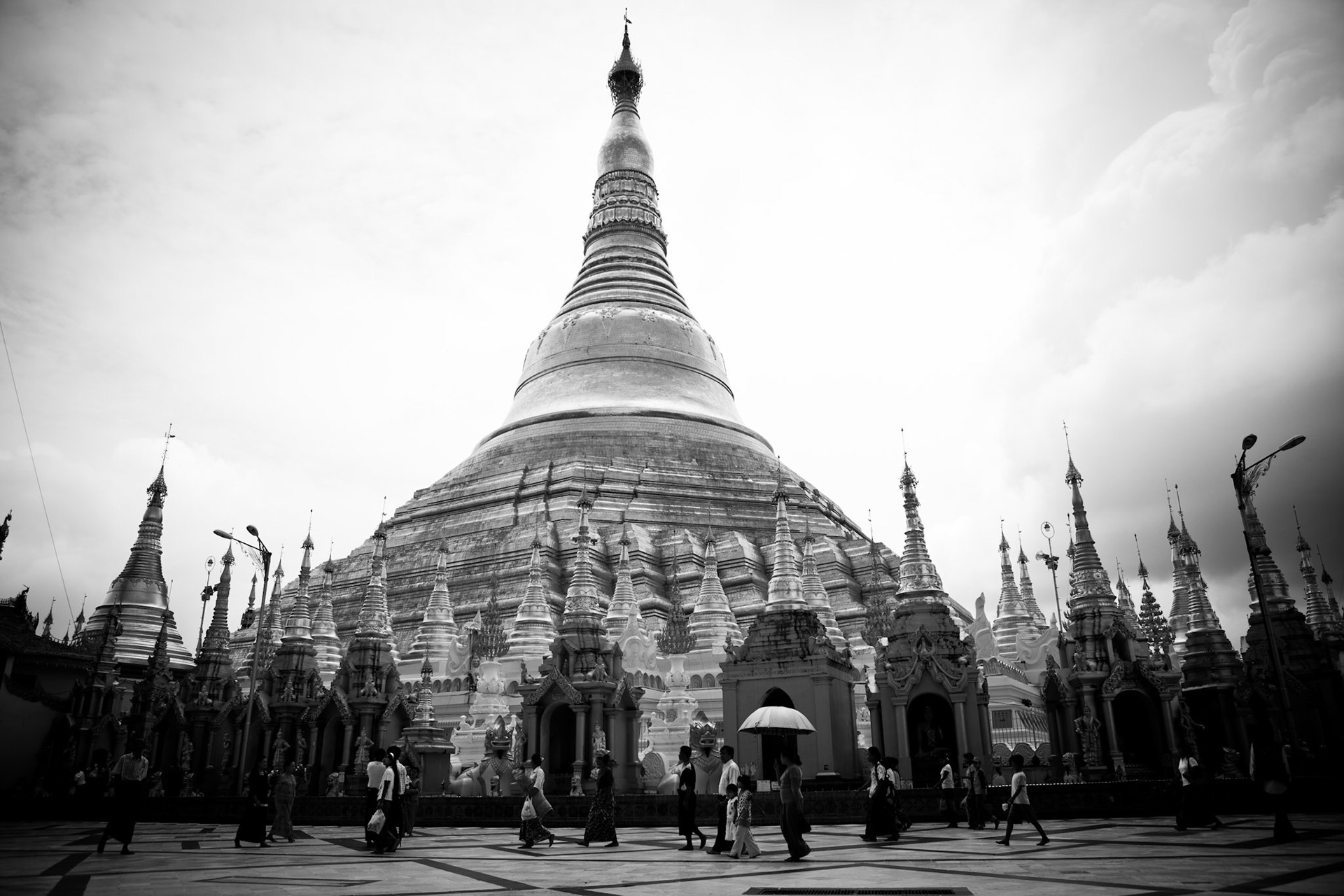 The Shwedagon Pagoda, Shwedagon Paya, in Rangoon, Burma, officially titled Shwedagon Zedi Daw and also known as the Golden Pagoda, is a 98-metre gilded stupa. It is the most significant and important Buddhist pagoda in Burma where everyday, monks, nuns, novices and hundreds of Burmese come to make offerings and pray