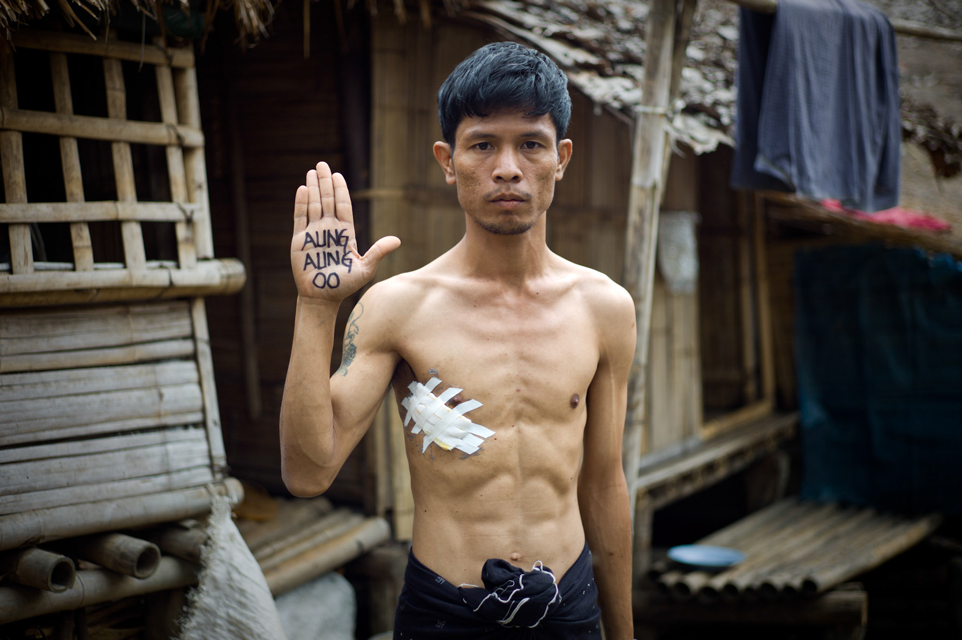 Tun Lin Kyaw, a former member of NLD youth and Tri-Colour Student Group, lived with Aung San Suu Kyi from an early age after his parents died. In 2004 he performed a solo protest outside City Hall in Rangoon, demanding the release of Aung San Suu Kyi and all political prisoners. He was arrested and spent 3 years in Insein prison. During interrogation he was badly tortured and had to have half of his lung removed. He was released from prison to receive emergency medical care but was re-arrested once he left hospital to serve the rest of his sentence. He fled Burma and is now a refugee in Umpiem Mai camp on the Thai-Burma border.
Aung Aung Oo, a student friend of Tun Lin Kyaw was arrested in March 2006 and sentenced to 14 years in Insein prison. He was freed under a presidential amnesty in January 2011