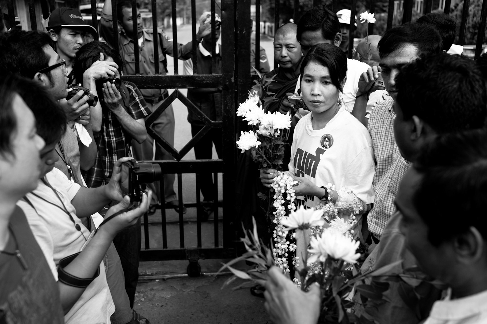 Leading human rights campaigner and former political prisoner herself, Su Su Nway stands at the gates of the notorious Insein prison in Rangoon awaiting the imminent release of political prisoners under the presidential amnesty