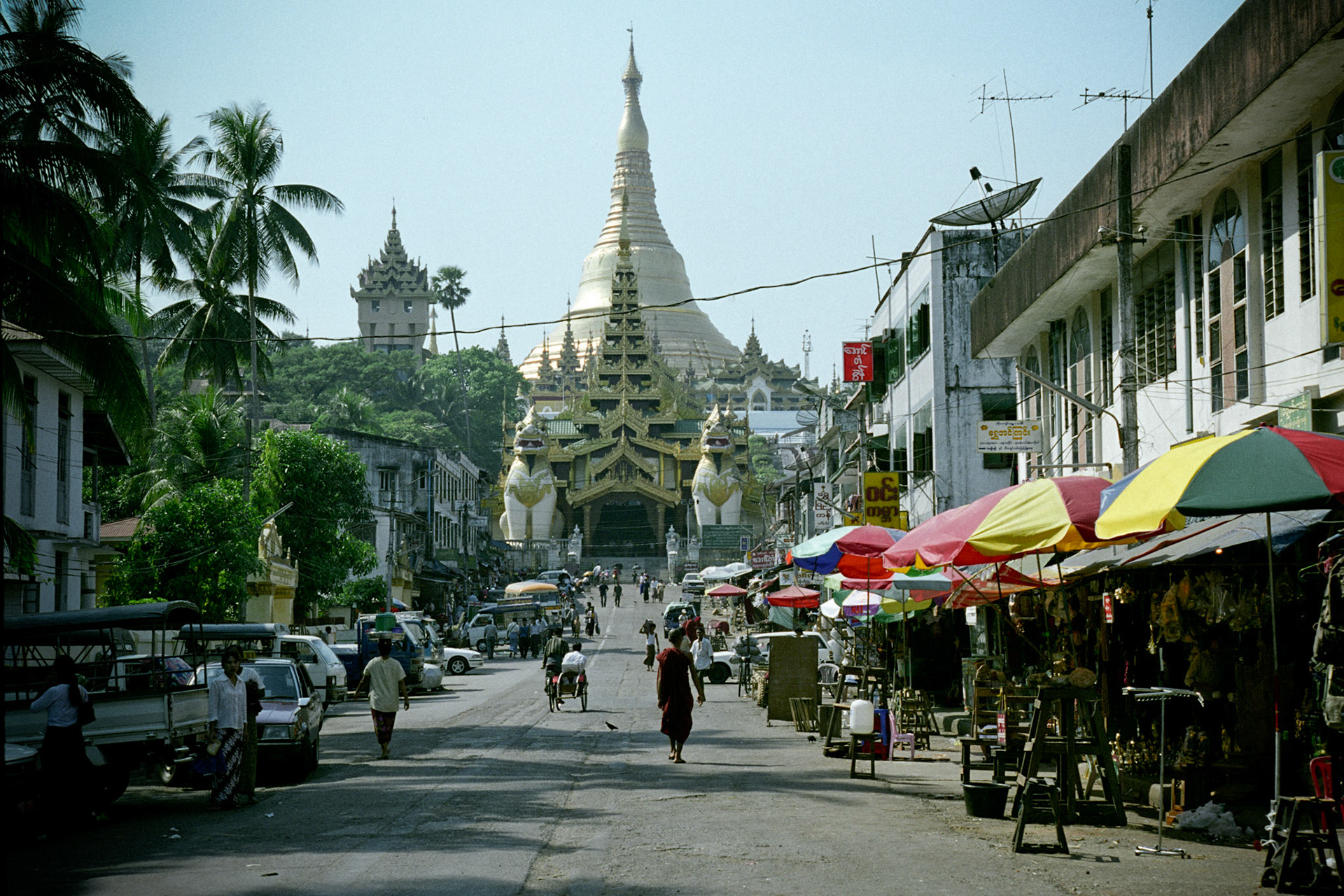 The east gate entrance to the Shwedagon Pagoda in Rangoon, Burma. The Shwedagon Paya, officially titled Shwedagon Zedi Daw and also known as the Golden Pagoda, is a 98-metre gilded stupa. It is the most significant and important Buddhist pagoda in Burma where everyday, monks, nuns, novices and hundreds of Burmese come to make offerings and pray
